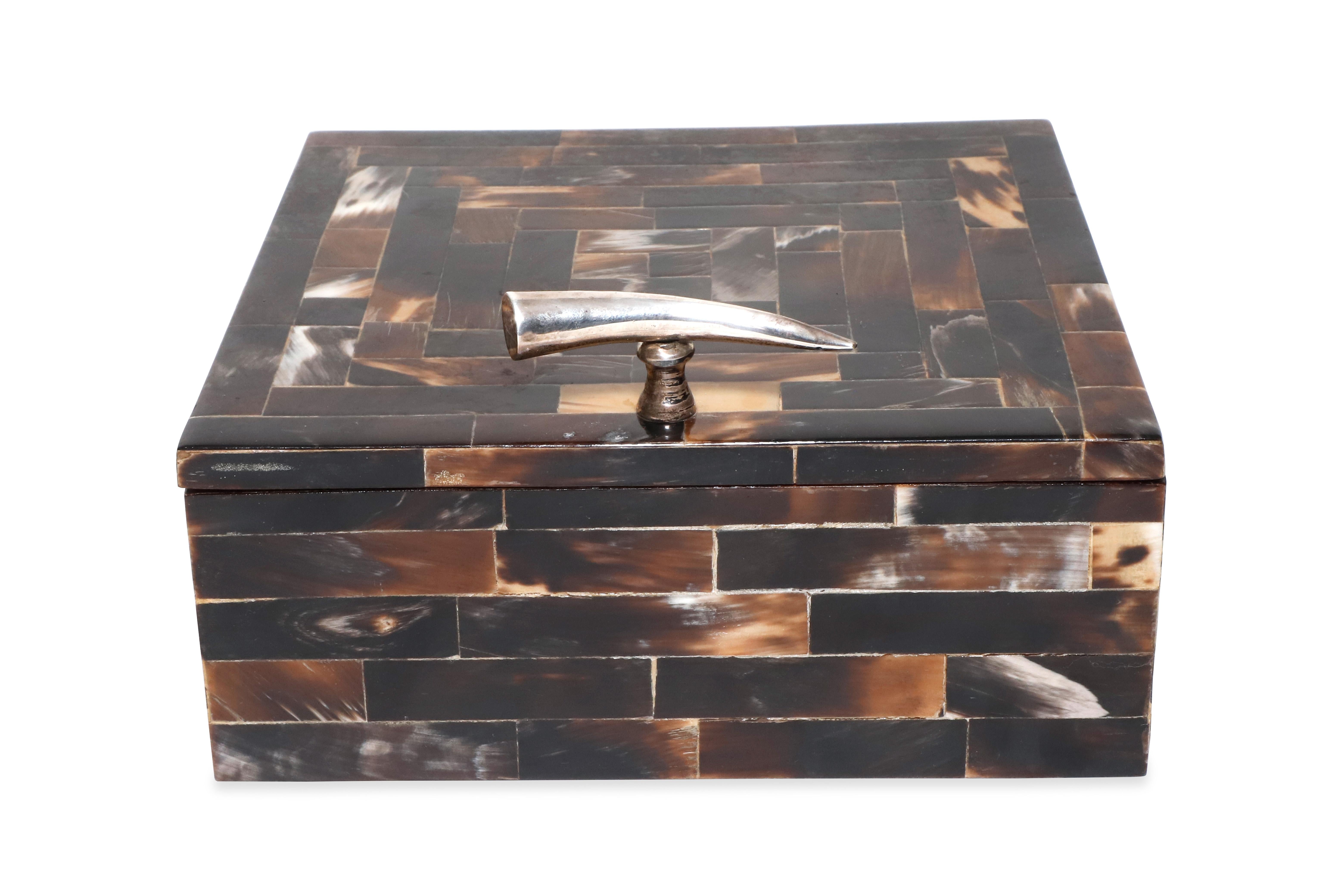 Square decorative box made out of Horn with a steel Horn handle. Interior made of wood with square comparments. 

Property from esteemed interior designer Juan Montoya. Juan Montoya is one of the most acclaimed and prolific interior designers in