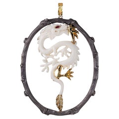 Hand-Carved Bone Dragon with Ruby Eyes Pendant 