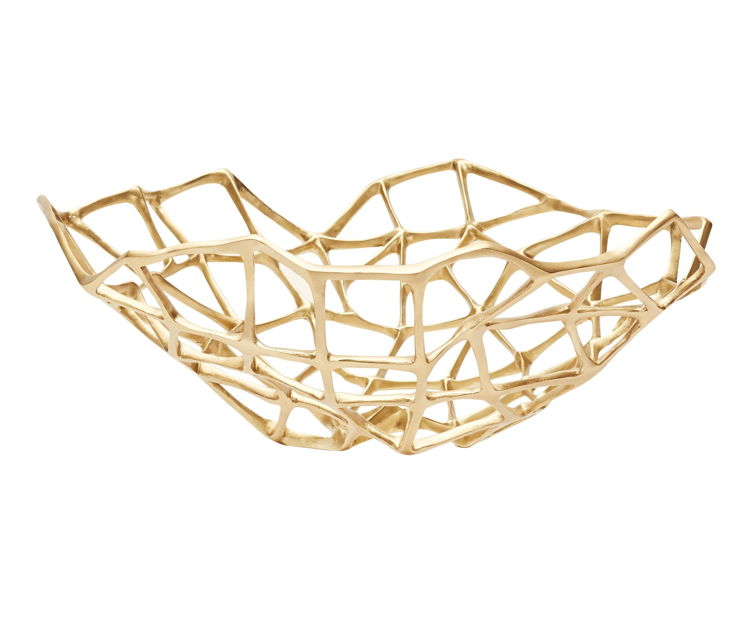 The extra large bone bowl is part of a series of sculptural artefacts cast in solid brass with a matte finish bearing a bone-like quality. Bone bowls can be displayed on their own as sculptures or used with dry food and decorations such as