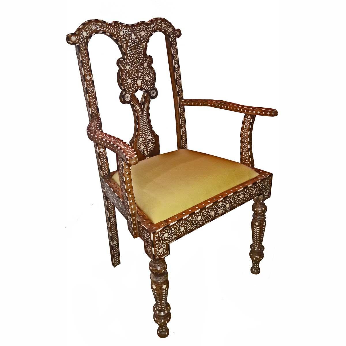 Bone-inlaid armchair, turned legs and back, from India, circa 1960. 
Removable cushion in yellow fabric that can be reupholstered. Each chair includes an extra removable cushion, which can also be reupholstered in any fabric. 

 Two chairs