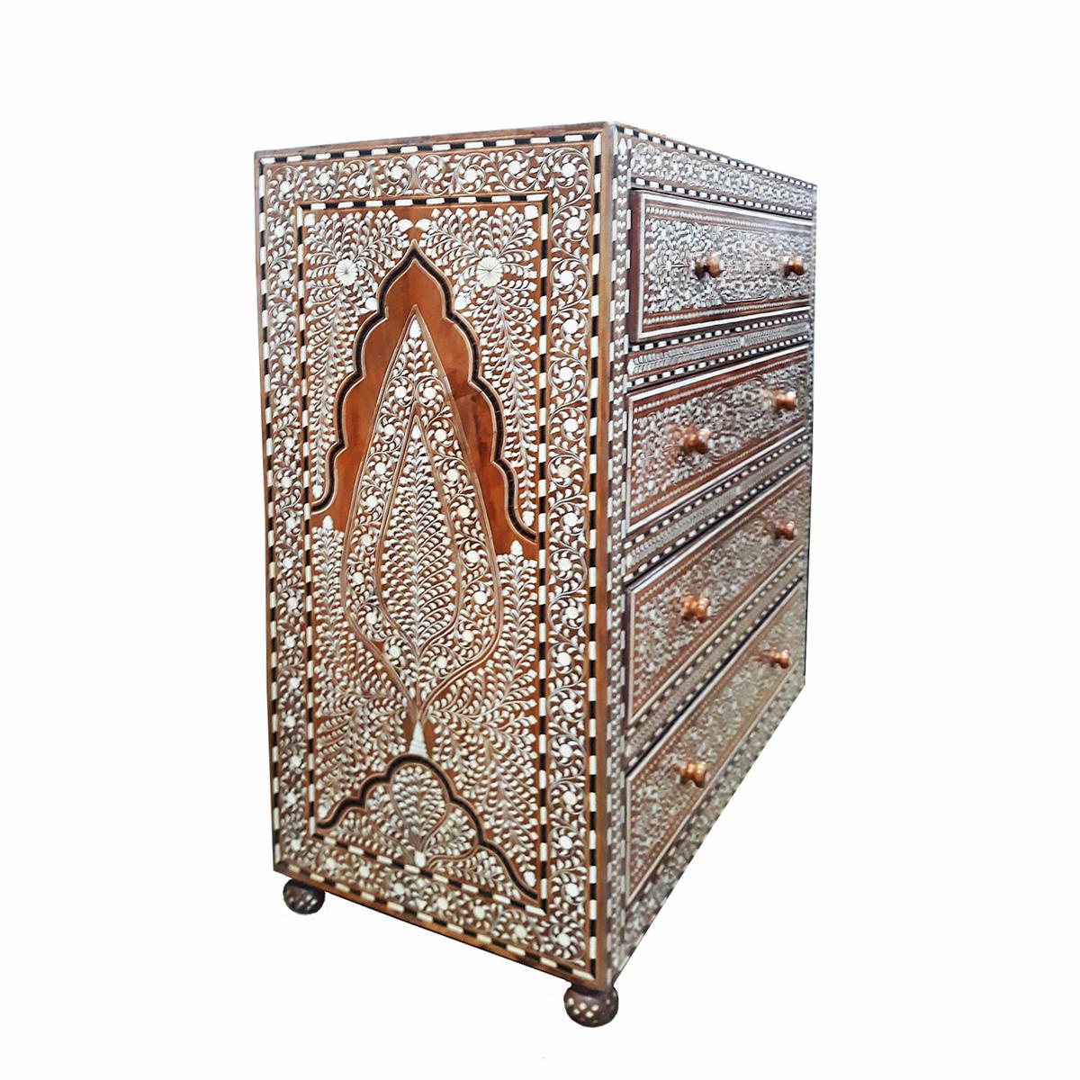 A charming 5-drawer chest, handcrafted in India out of aged teak wood and cruelty-free sourced animal bone inlays. 

Inlay is ancient decorative technique that involves embedding delicate, hand-carved pieces of bone (initially it was ivory) into