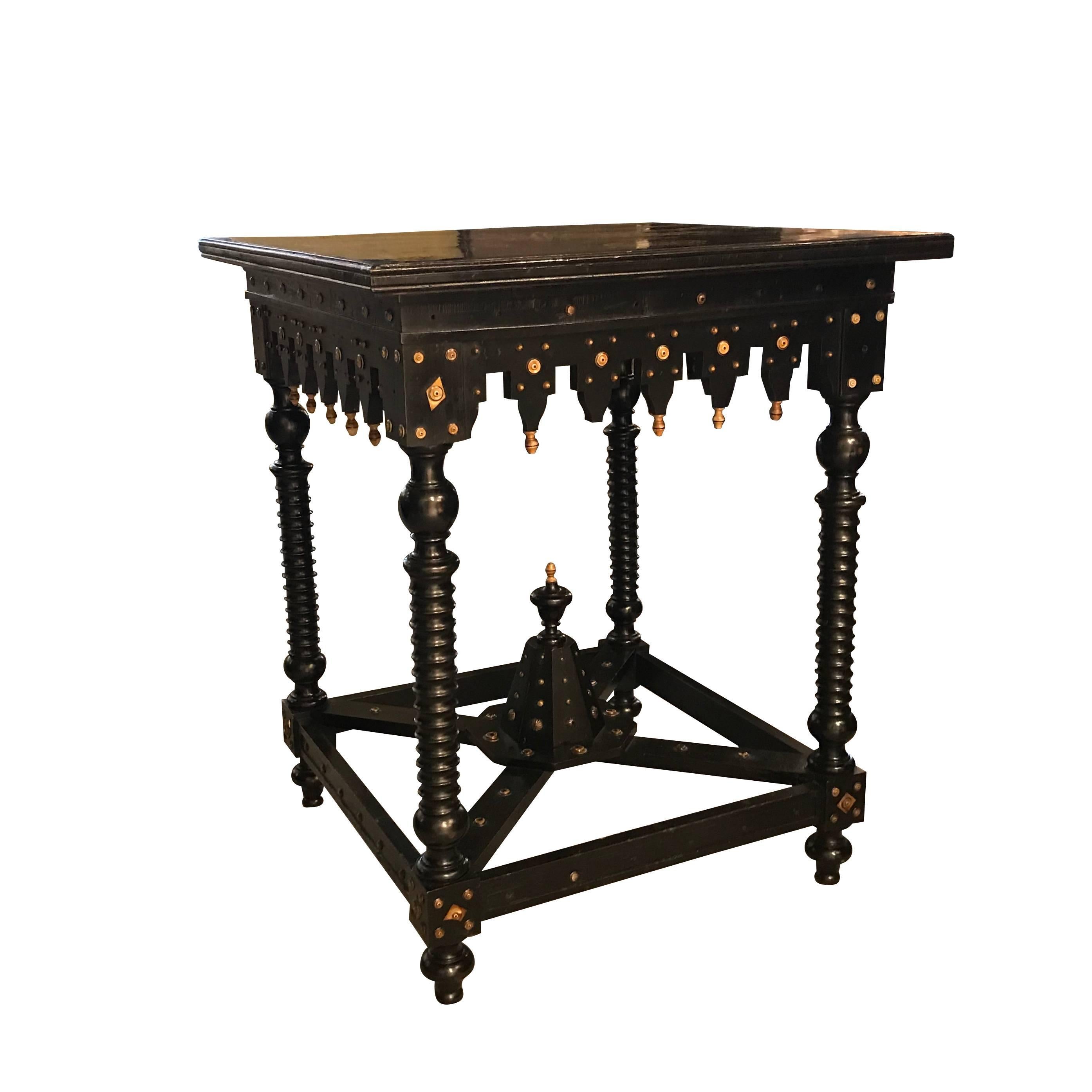 19th century Italian ebonized table with bone inlay.
Decorative details.
Carved gold gilt wood trim details.