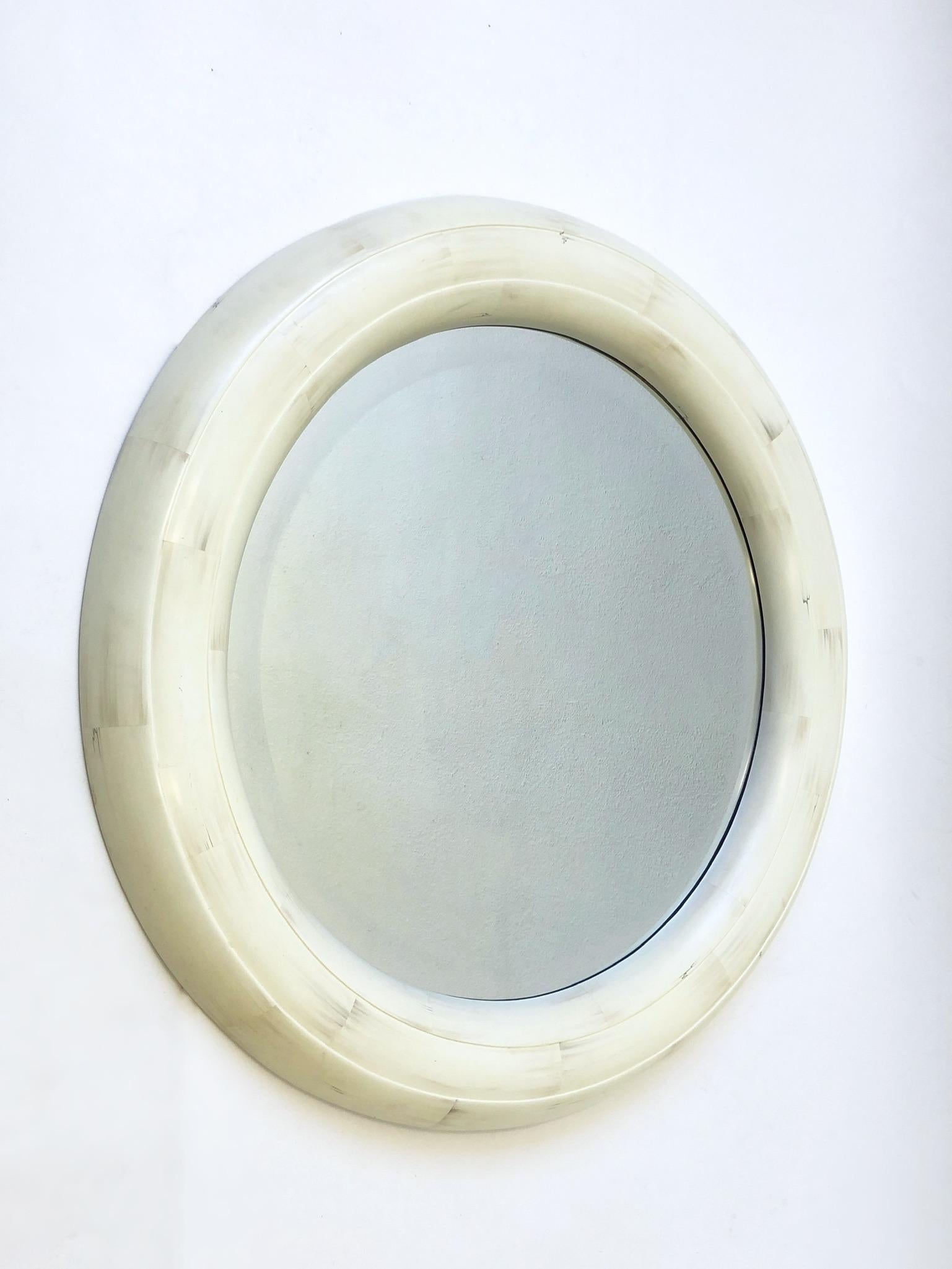 1980’s Bone lacquered round beveled mirror in the manner of Karl Springer.
This came out of a Steve Chase estate, were he used several Karl Springer items. 
Measurements: 41.5” diameter, 2.5” deep.
