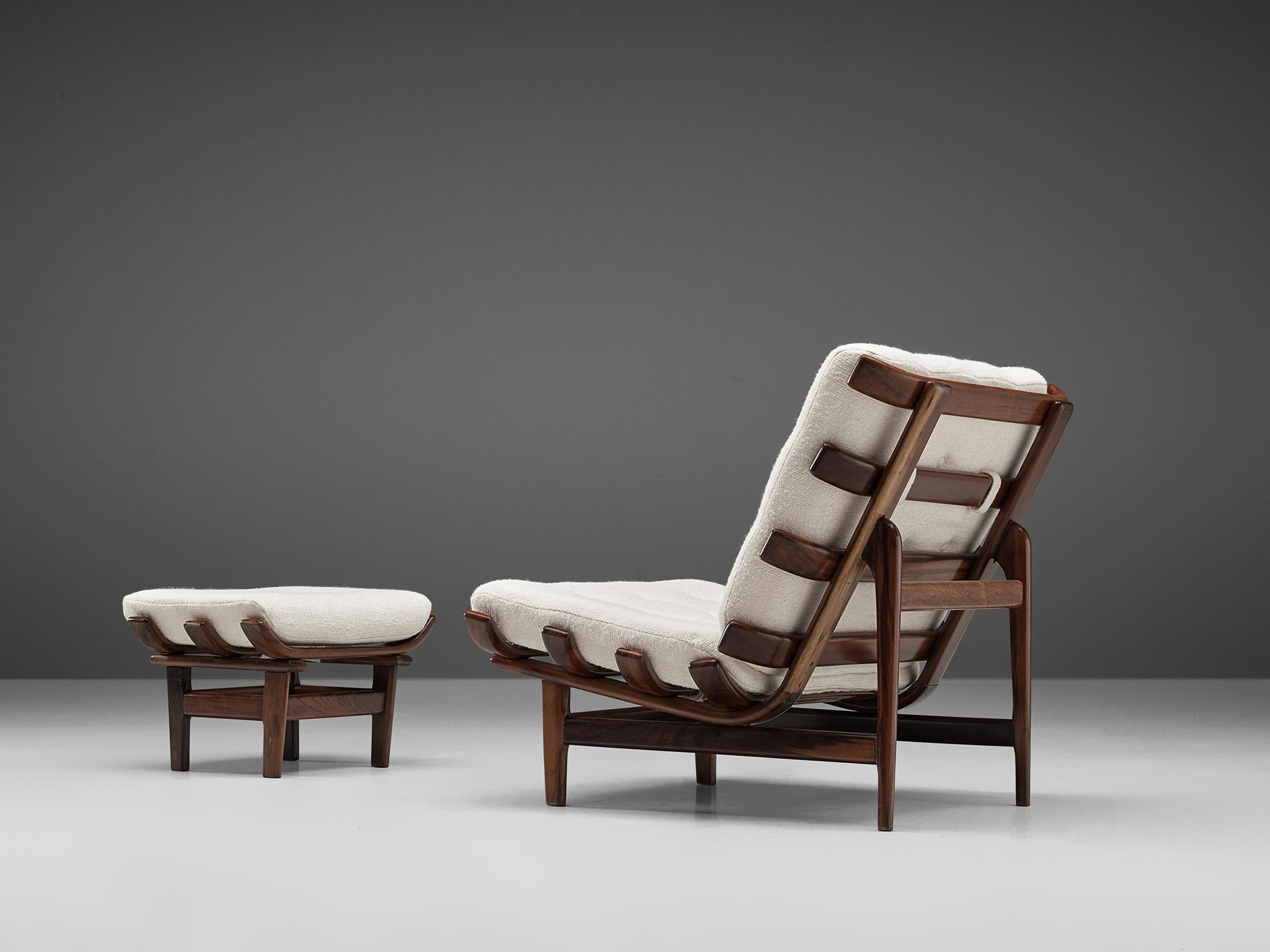 Bone lounge chair with ottoman, jacaranda wood, Brazil, 1960s. 

Brazilian 'Bone' chair, an iconic design for Brazilian Mid-Century Modern, from the 1960s. This particular piece is completely executed in jacaranda wood. These are straight in the