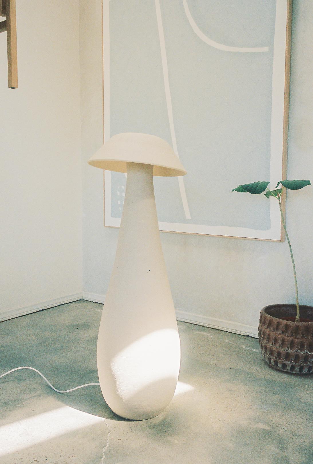 Bone white raw mushroom floor lamp by Nick Pourfard
Dimensions: Ø 51 x H 122 cm.
Materials: ceramic.
Different finishes available. 

All our lamps can be wired according to each country. If sold to the USA it will be wired for the USA for