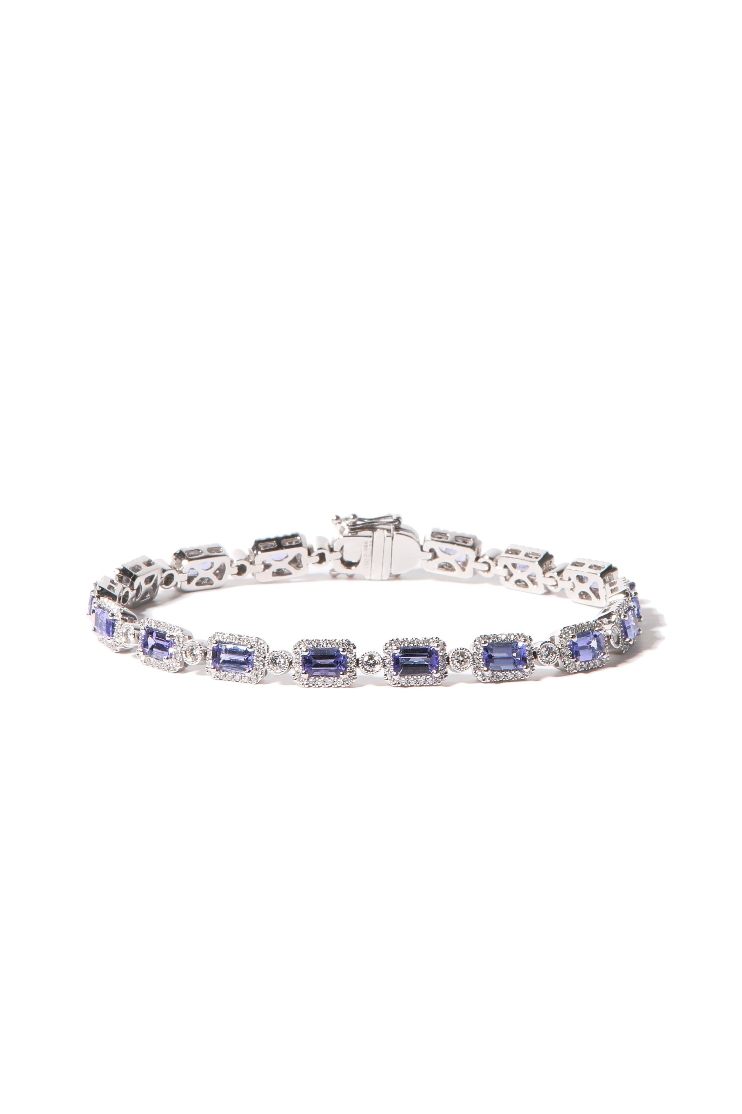 Emerald cut tanzanites grace this extraordinary bracelet.

The bracelet is made in 18kt white gold and is set with 17 emerald cut tanzanites weighing 5.29 carat and 1.53ct round brilliant cut diamonds. The links connecting the sapphires are set with