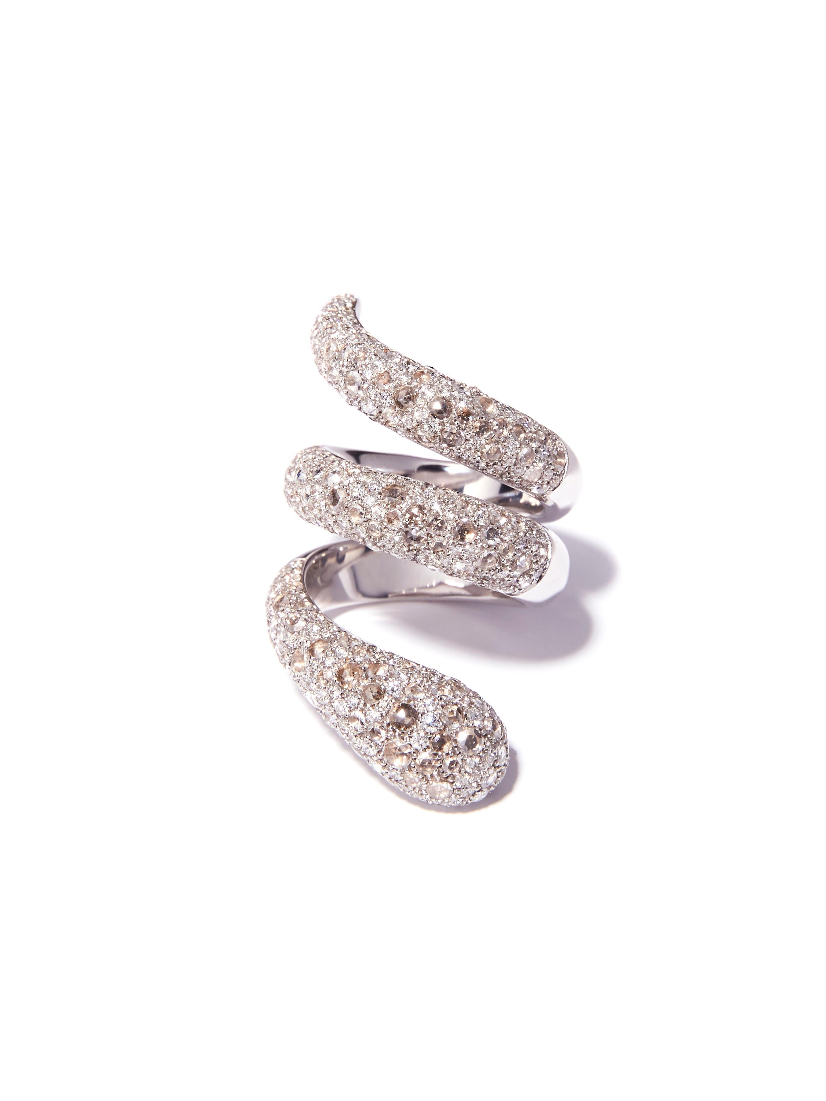 This exceptional ring is designed as a coiled snake. It is pave set with 2.72 carat rose cut diamonds and 1.98 carat brilliant cut diamonds resembling the pattern of snakeskin. A bold, yet comfortable design, this snake ring slithers up the finger