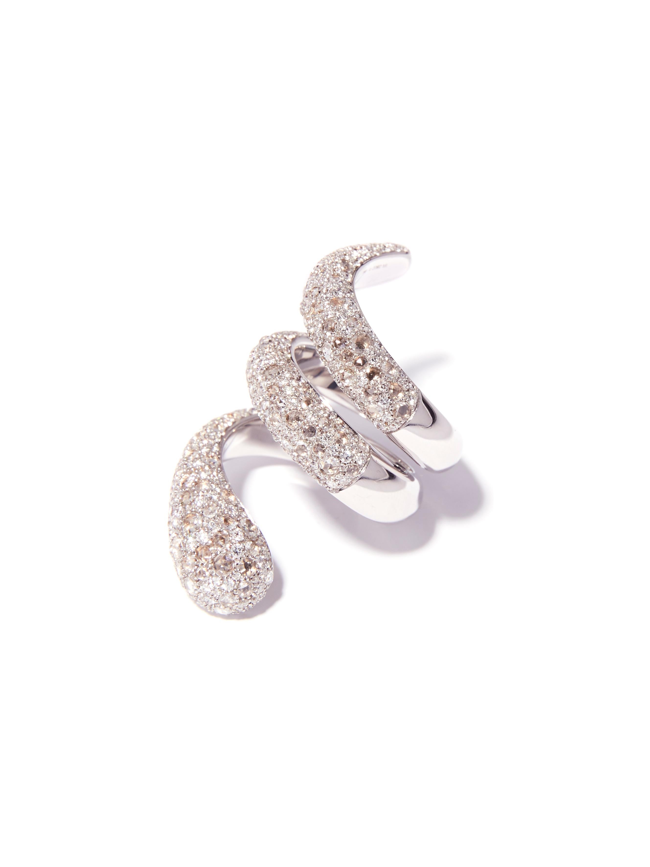 This exceptional ring is designed as a coiled snake. It is pave set with 2.72 carat rose cut diamonds and 1.98 carat brilliant cut diamonds resembling the pattern of snakeskin. A bold, yet comfortable design, this snake ring slithers up the finger