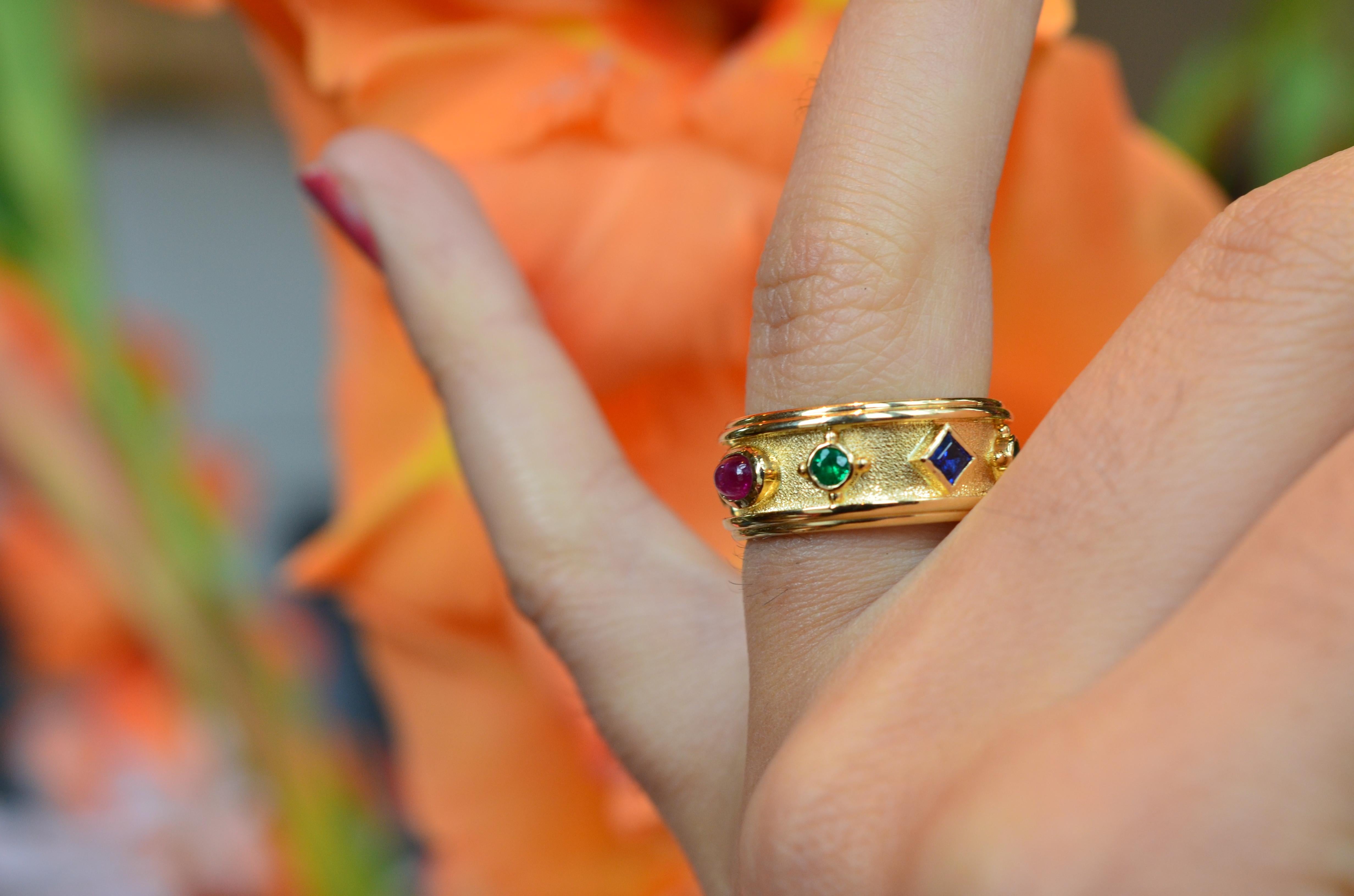 18 karat yellow gold Bonebakker band ring set with sapphires, emeralds and a ruby. 

A unique ring inspired by the Crown of the Kingdom of the Netherlands made in 1840 by the master goldsmiths of Bonebakker, an honourable commission by  King Willem