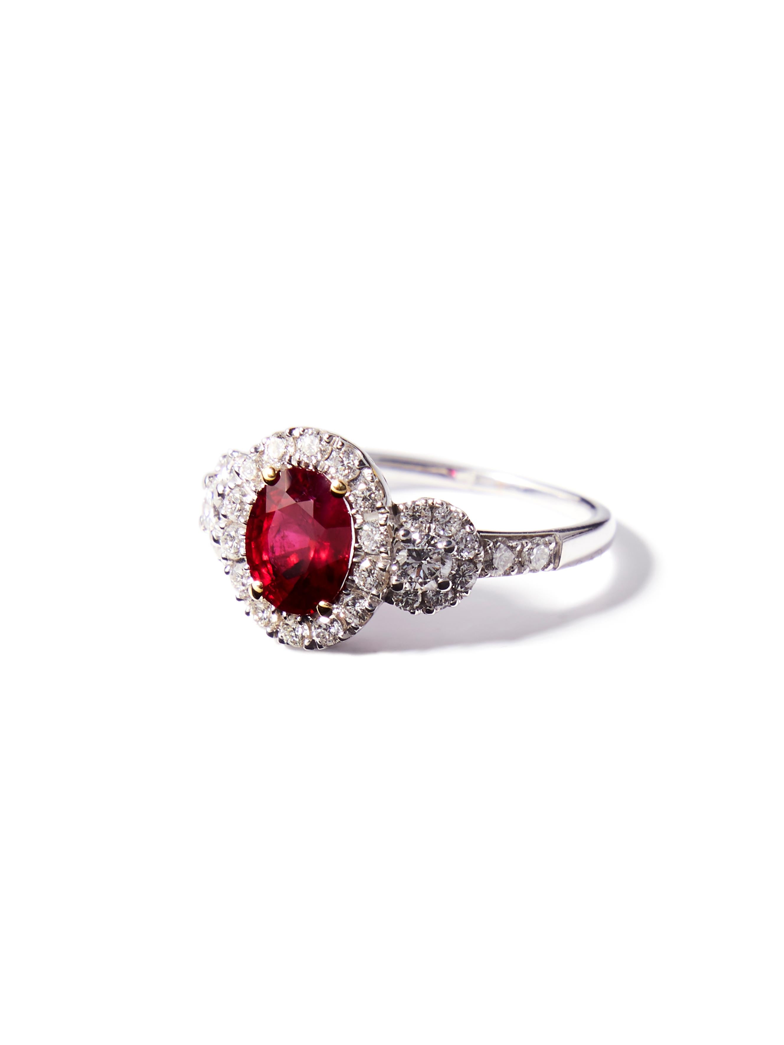 This 18 karat white gold ring features an untreated strong to deep red Ruby weighing 1.40 carat. The country of origin of the ruby has been determined to be Burma, known since early medieval times as the provenance of the best rubies worldwide.

Two