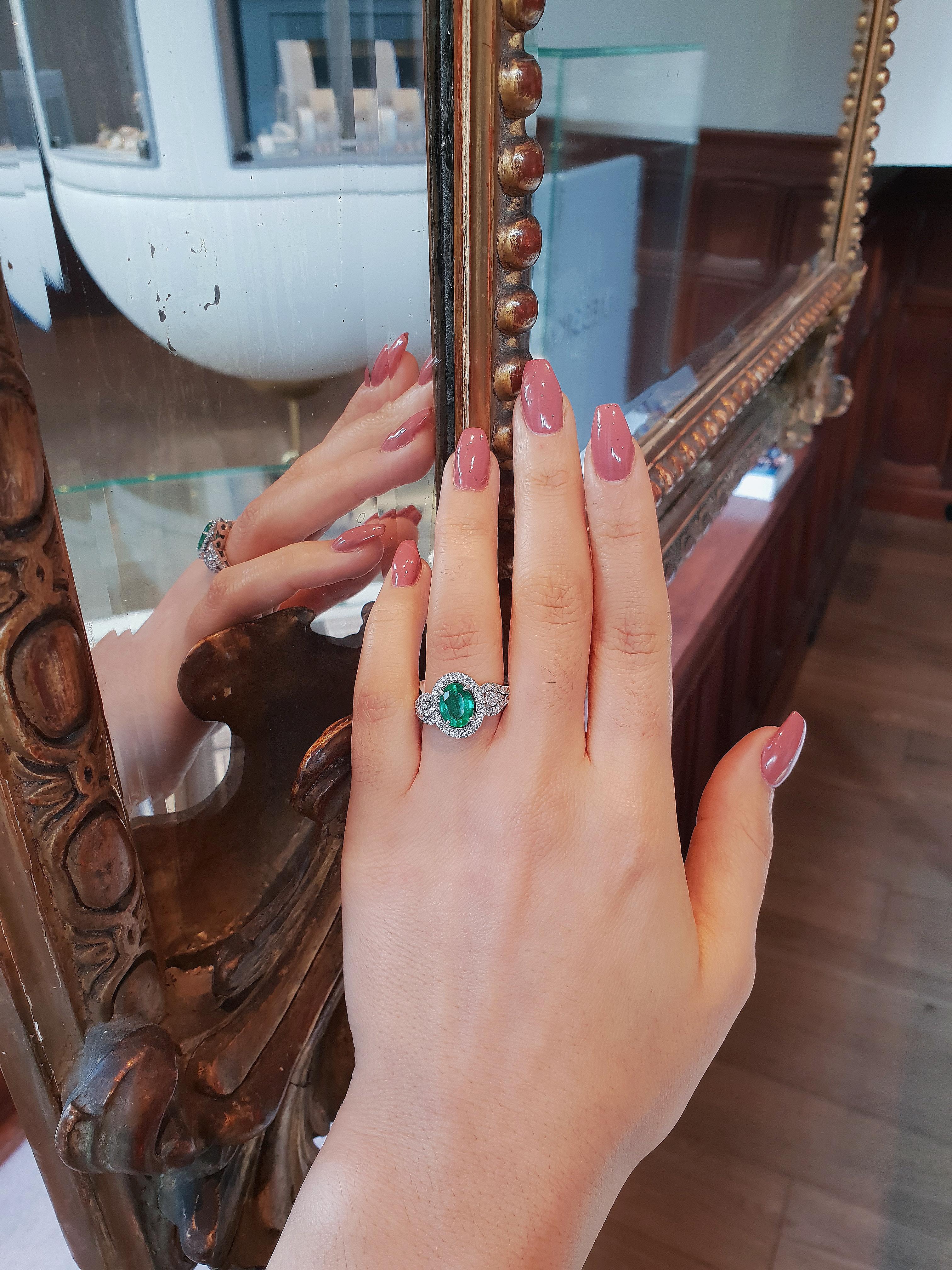 Oval Cut White Gold Engagement Ring with 1.50 Carat Oval Emerald and Diamonds