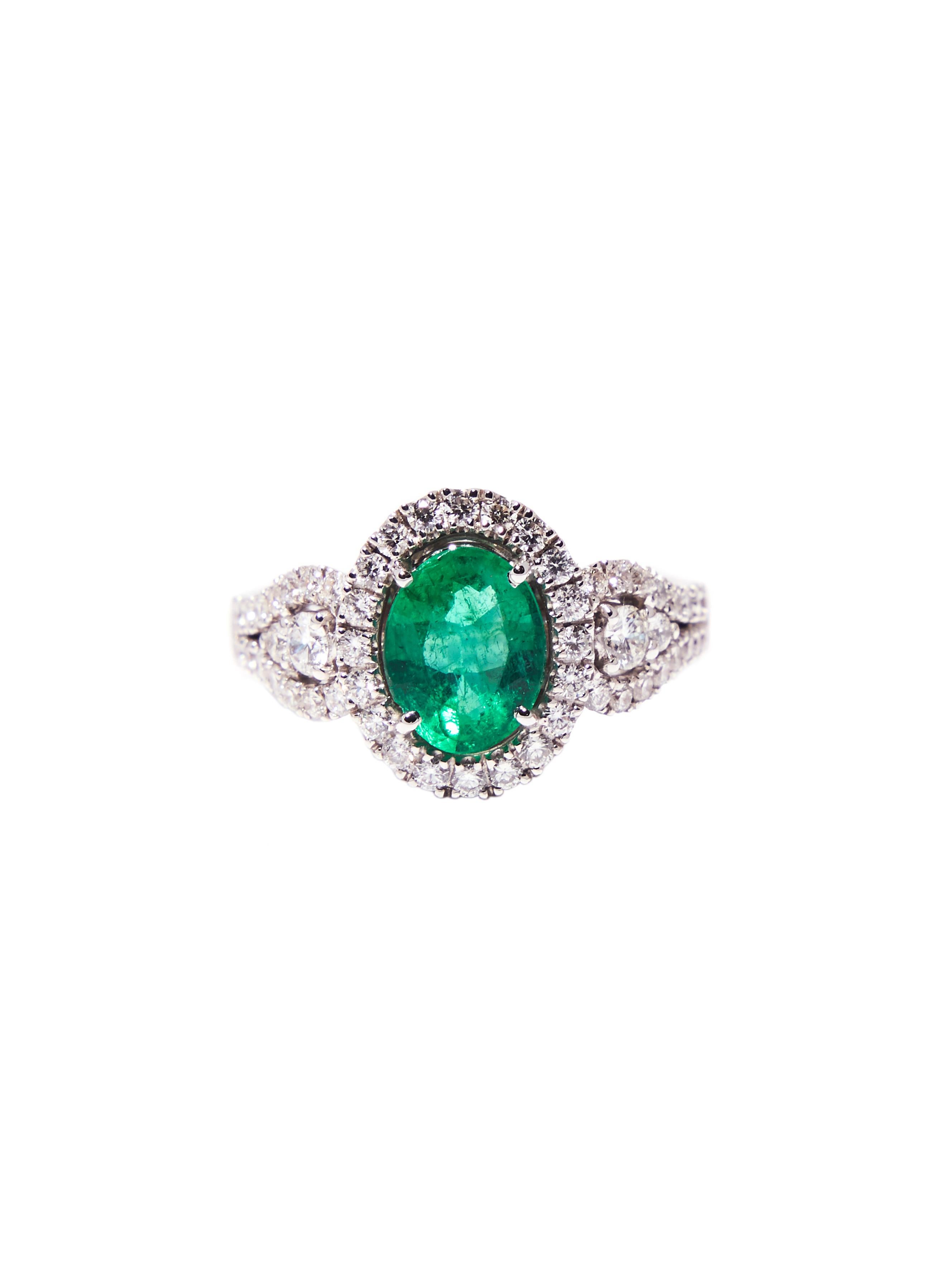 Women's White Gold Engagement Ring with 1.50 Carat Oval Emerald and Diamonds