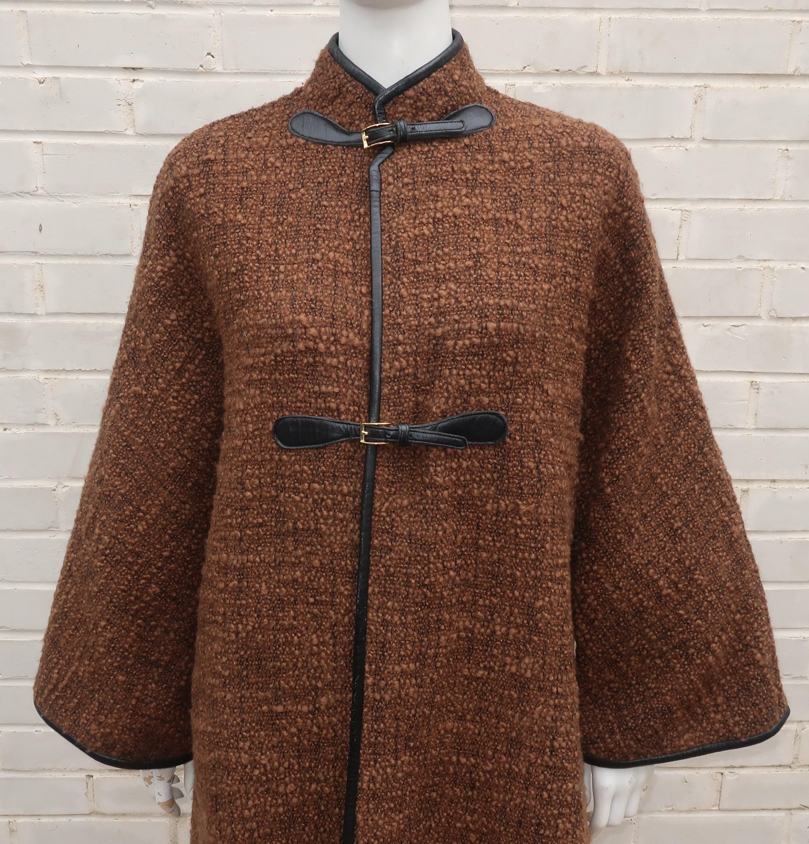 A fabulous 1960's wool boucle coat by one of the most influential and innovative American designers of the 20th century, Bonnie Cashin.  Ms. Cashin's fondness for mixing fabrics and textures is at play in this design with a nubby brown and black