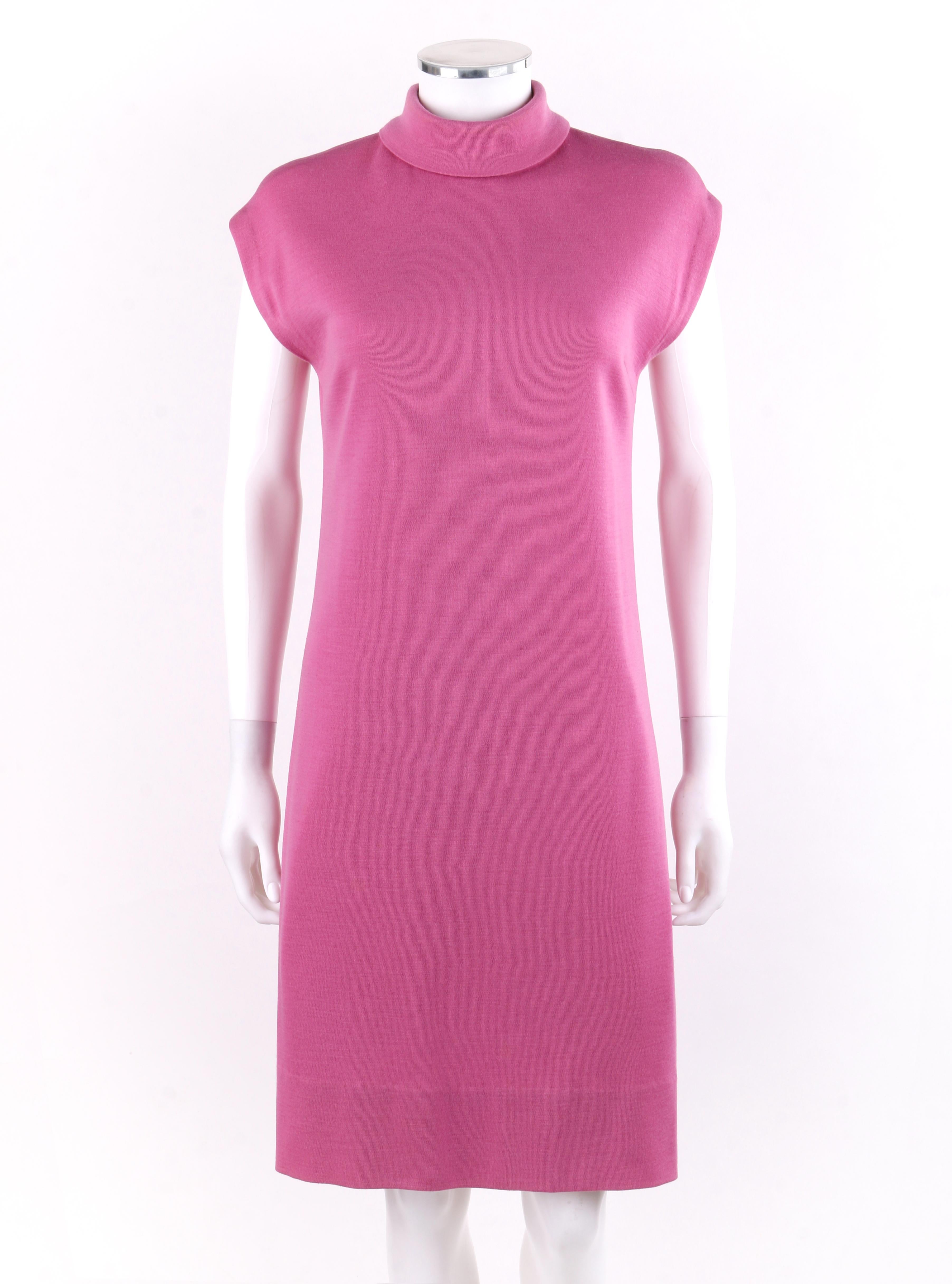 BONNIE CASHIN c.1960’s Pink Cap Sleeve High Neck Belted Shift Dress

Circa: 1960’s
Label(s): Sills Bonnie Cashin
Designer: Bonnie Cashin
Style: Shift dress with cap sleeves and folded high neck collar; thin ultrasuede belt
Color(s): Shades of