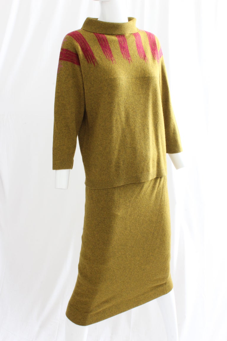 This incredible two-piece ensemble was designed by the most significant American designer of our time, Bonnie Cashin.  Made from an incredibly supple mustard cashmere knit, it features an abstract intarsia design in raspberry on the front and in
