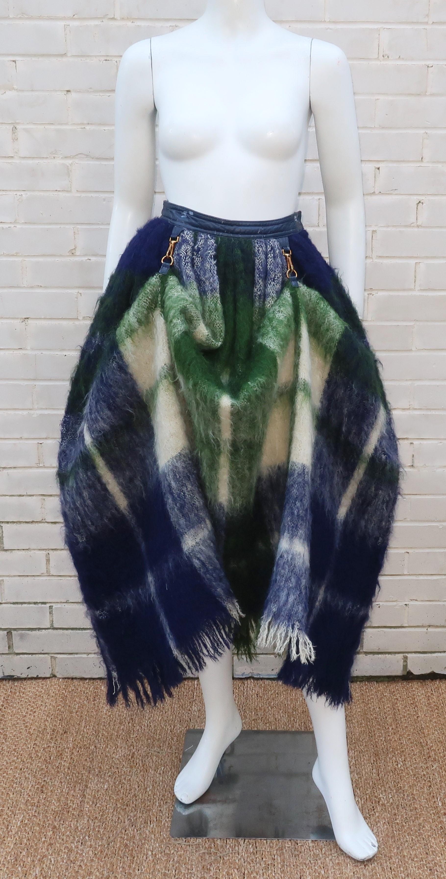 This is an early version of Bonnie Cashin's iconic dog leash skirt in a blue, green and ivory white plaid mohair with blue leather waistband.  Bonnie Cashin was one of the great innovators of modern fashion and helped create the American look and