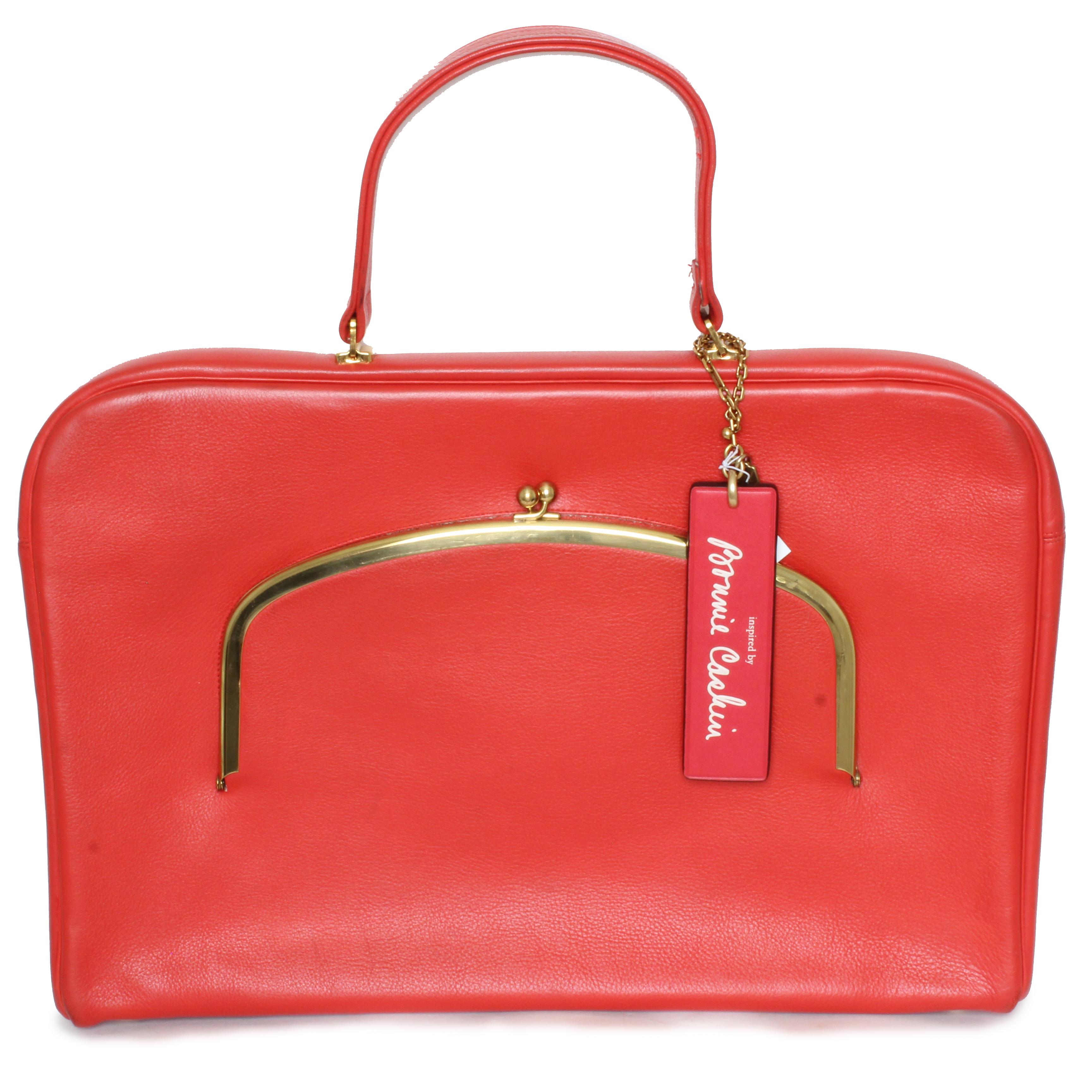 Vintage Bonnie Cashin for Coach 'Cashin Carry' leather attache or briefcase bag, likely made in the 60s.  Fabulous and rare - this is a classic style with an incredibly vibrant color (as you would expect from Bonnie Cashin).  Made from a red leather