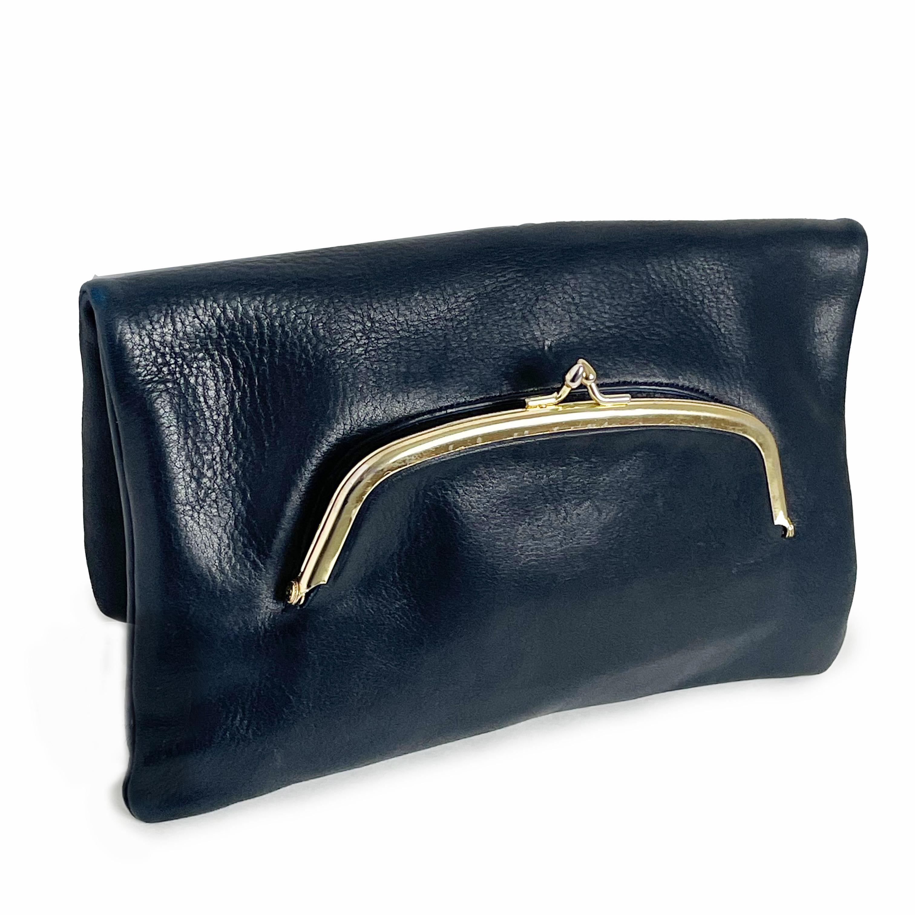 Authentic, preowned, 70s Bonnie Cashin for Coach bag clutch with kiss lock.  Made from a supple blue textured leather, this rare clutch is square-shaped with fold over styling and features a handy little kiss lock pocket in front!  The interior is
