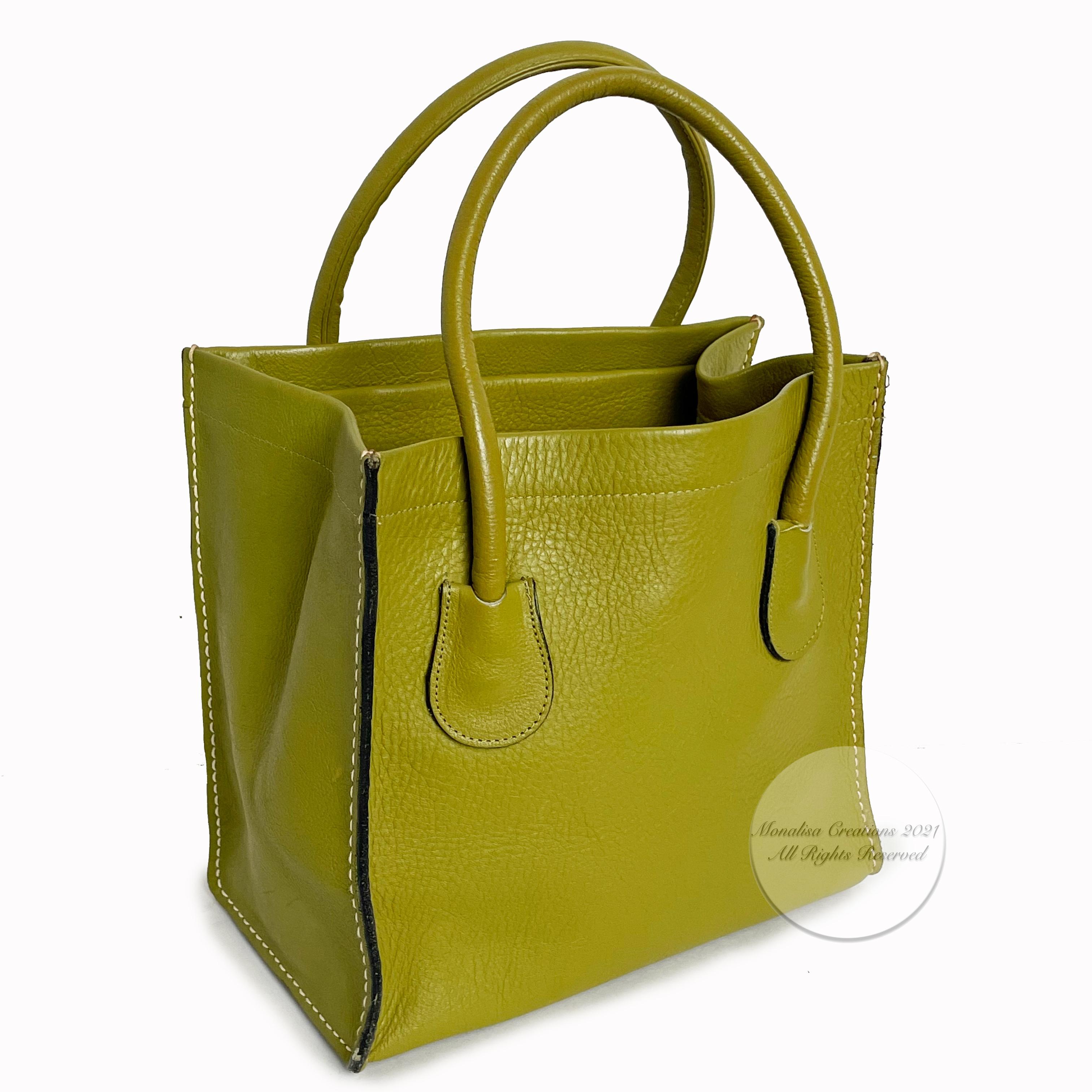 Authentic, preowned, vintage Bonnie Cashin for Coach Lime Green Leather Tote Bag, from the 60s. Partially-lined in canvas with one interior toggle pocket. Bottom has cardboard to keep shape (not sure if this is original). Tagged with both black