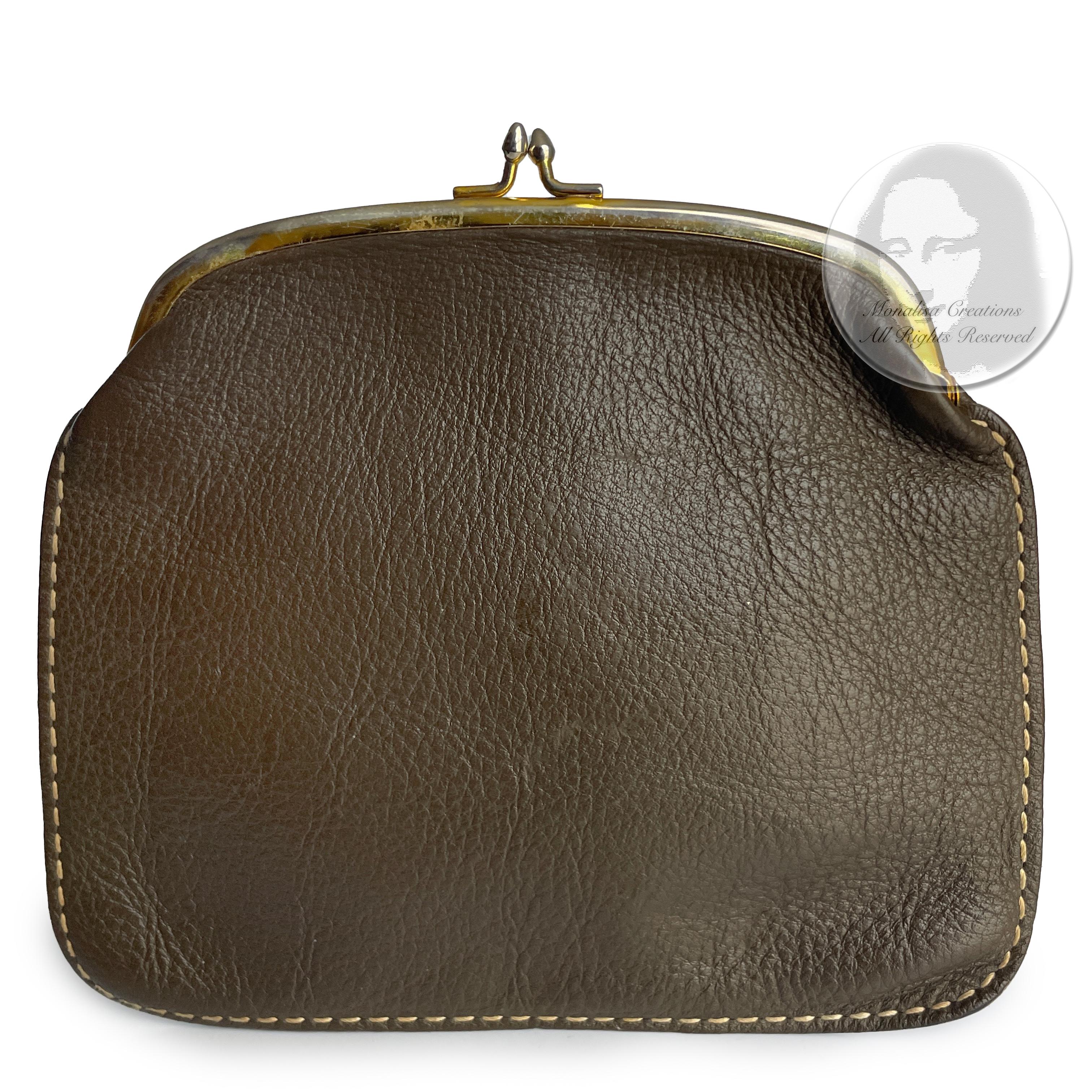 Bonnie Cashin for Coach 'foldover purse' or clutch bag, part of Bonnie's Cashin Carry accessories collection and likely made in the late 1960s.  Made from olive hued brown leather with white contrast exterior stitching, this unique little bag