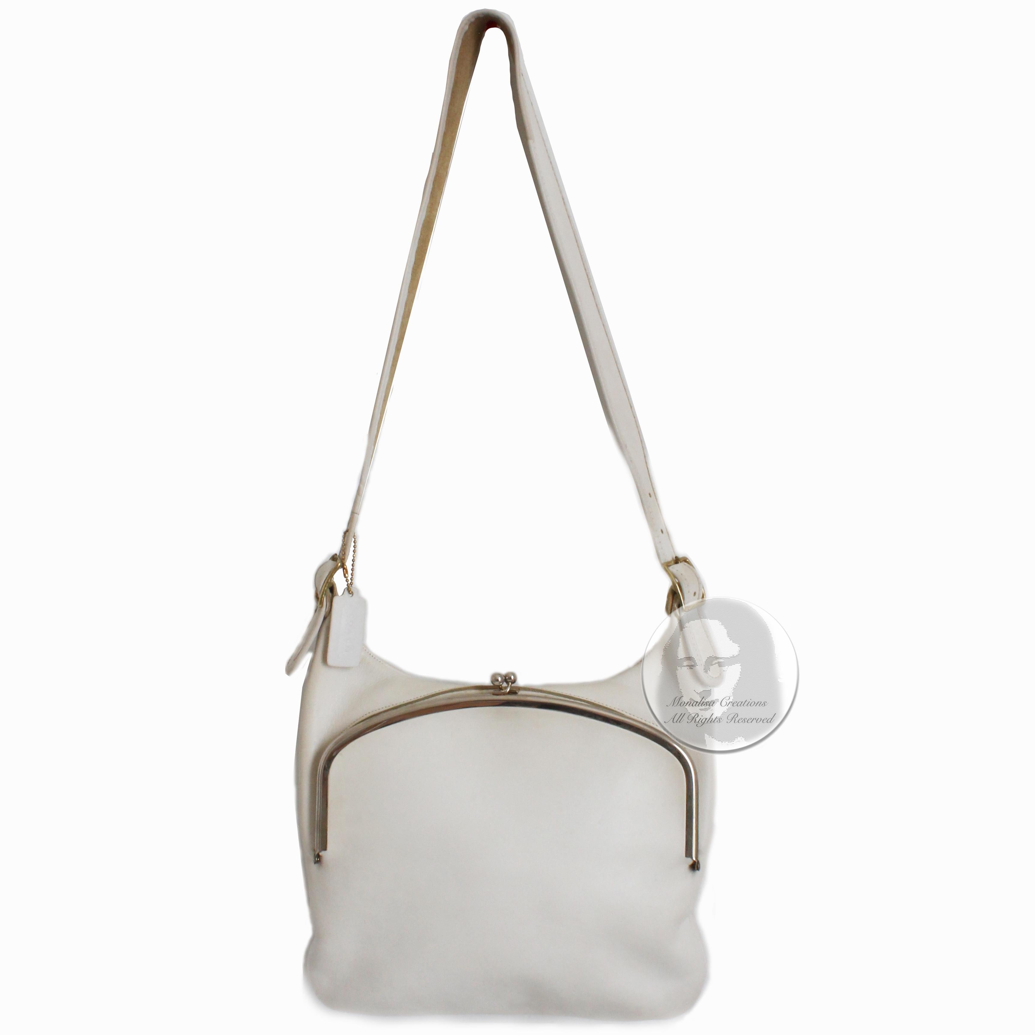 Authentic, preowned, vintage Bonnie Cashin for Coach Frame Bag aka the 'wide mouth' or 'guitar strap' bag, likely made in the 1970s. Made from white leather, this chic vintage bag features a huge kiss lock fastener and a spacious, unlined interior. 