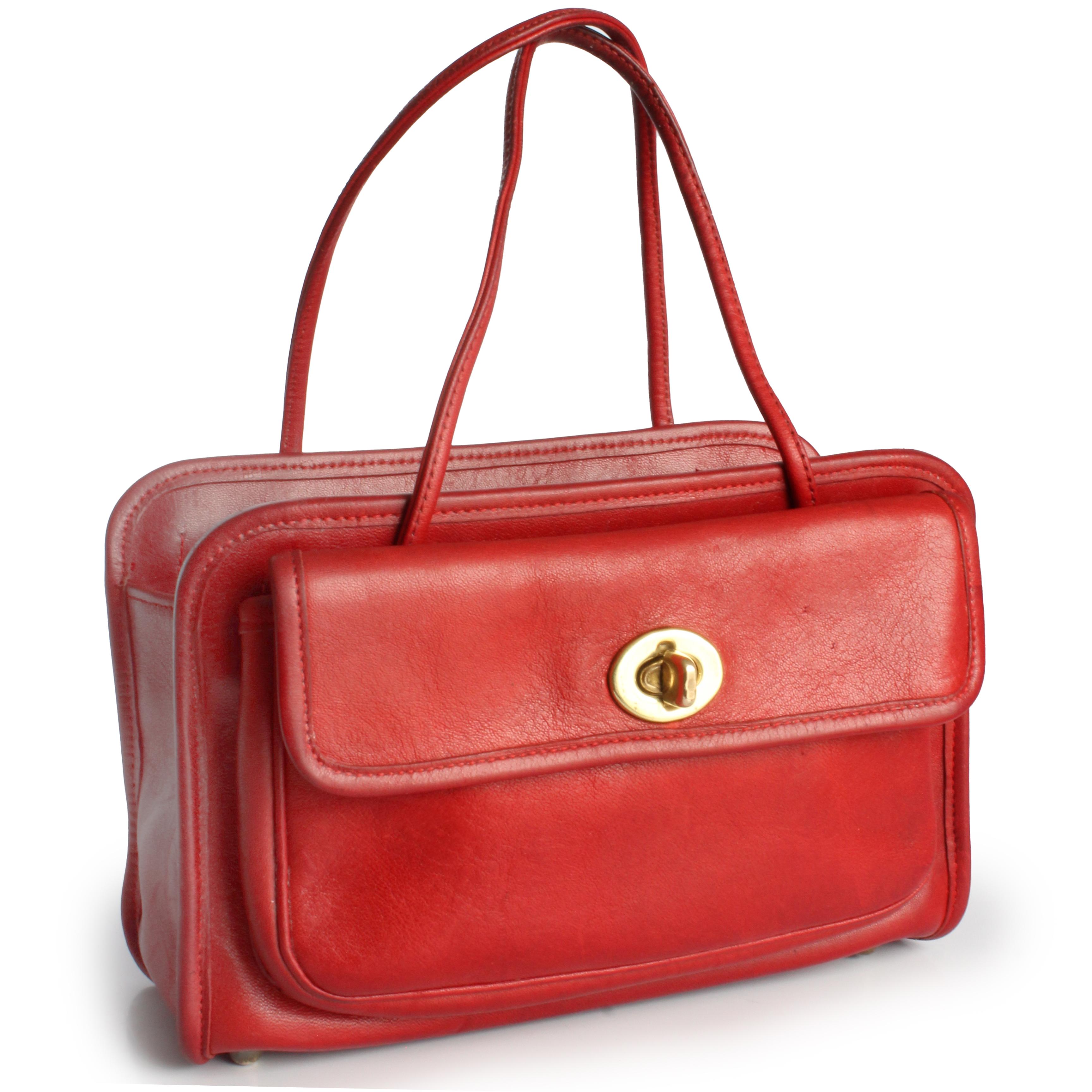 Preowned, vintage Bonnie Cashin for Coach Mini Safari tote bag, likely made in the late 1960s.  

A unicorn.  These bags rarely if ever come up for sale, especially in this color!  Made from red leather, this chic little bag features turn lock