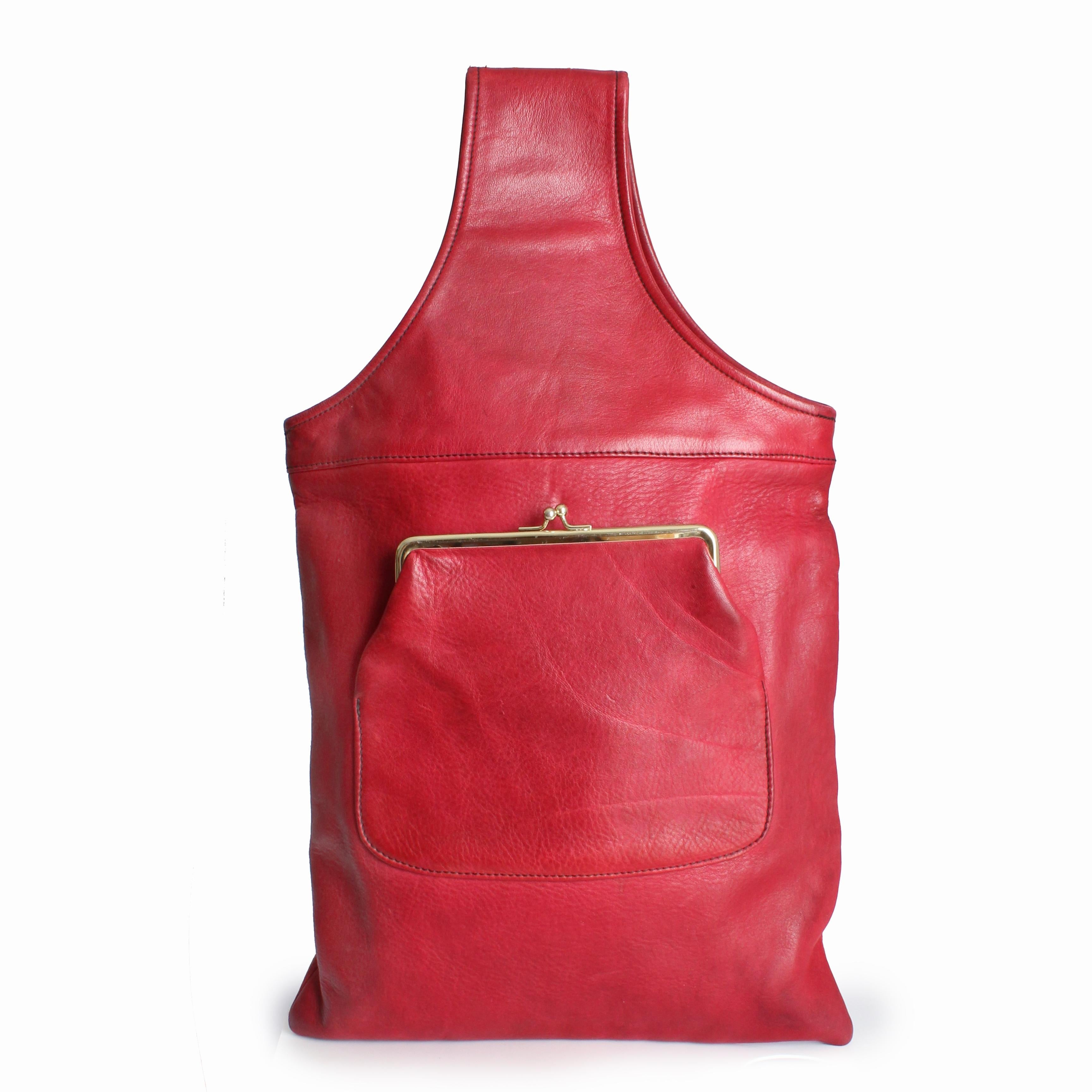 Preowned, vintage Bonnie Cashin for Coach Sling Bag, circa the mid 1960s. Made from a dark red (almost burgundy) 
