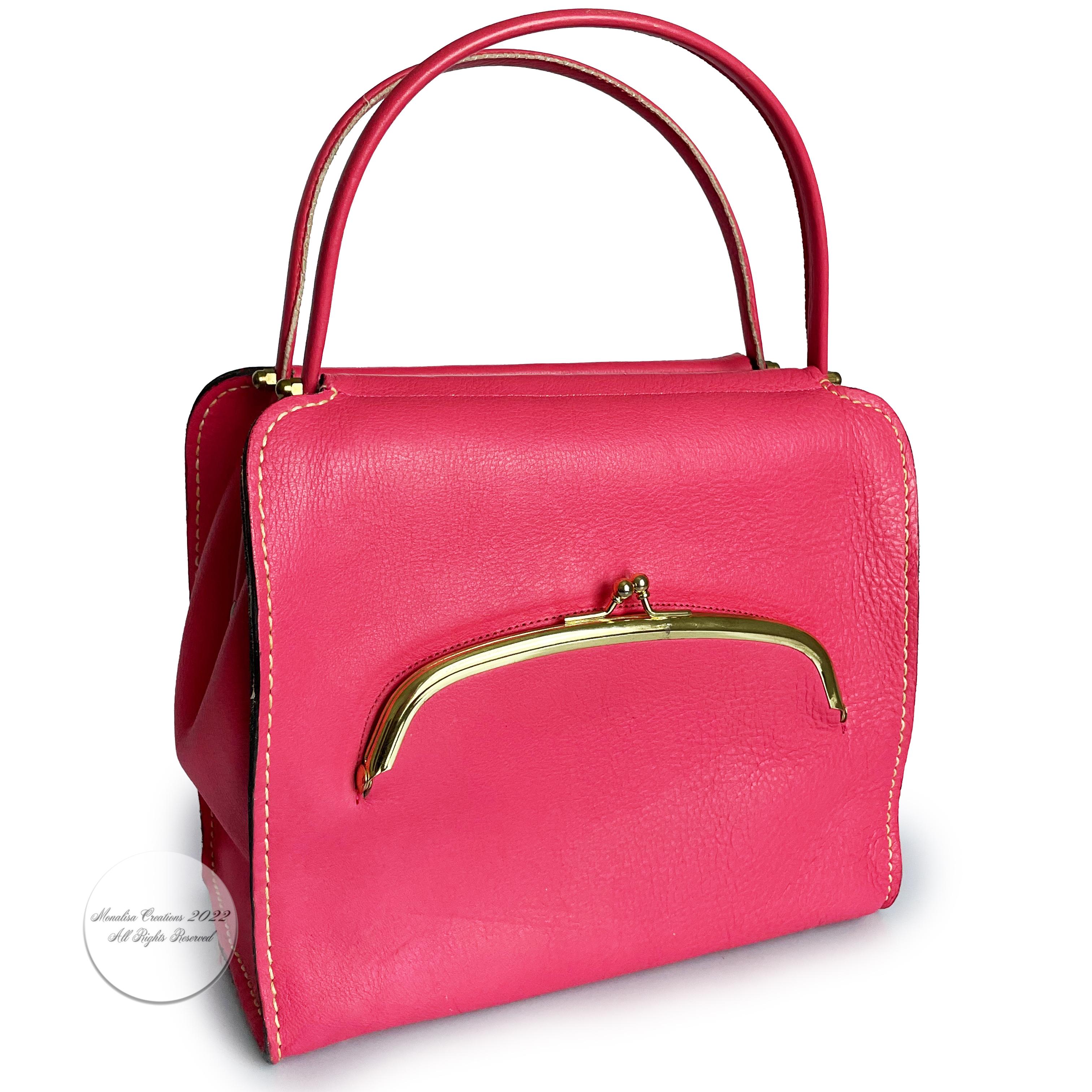 Authentic preowned, vintage Bonnie Cashin for Coach Tote Bag. This is a hard to find style from the 60s and officially called the Cashin Carry Scissor Frame bag.   Made from vibrant pink leather, with hinged double handles and Bonnie's signature
