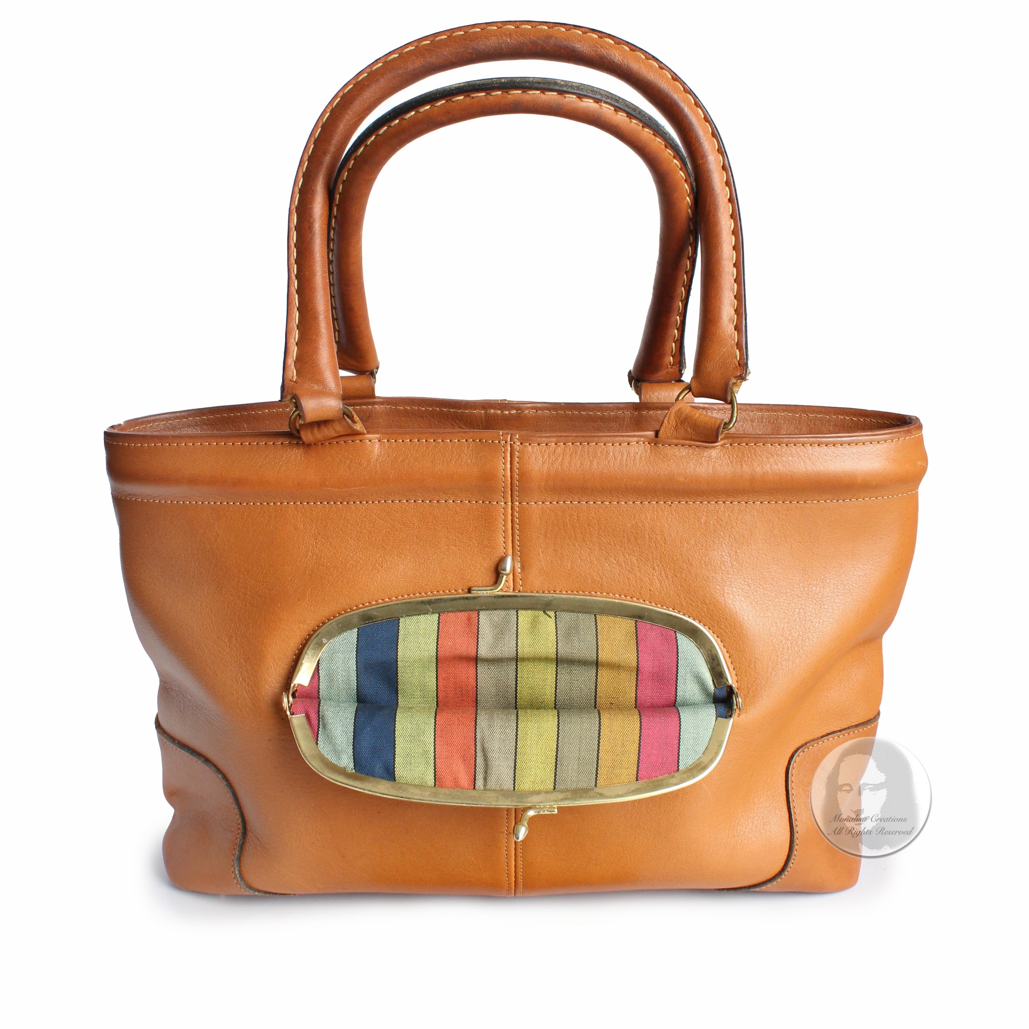 Authentic, preowned, vintage & rare Bonnie Cashin for Coach tote bag with kiss lock coin pouch, likely made in the 1960s. Made from tan harness leather, it's lined in Bonnie's signature striped fabric! The front kiss lock pouch is perfect for