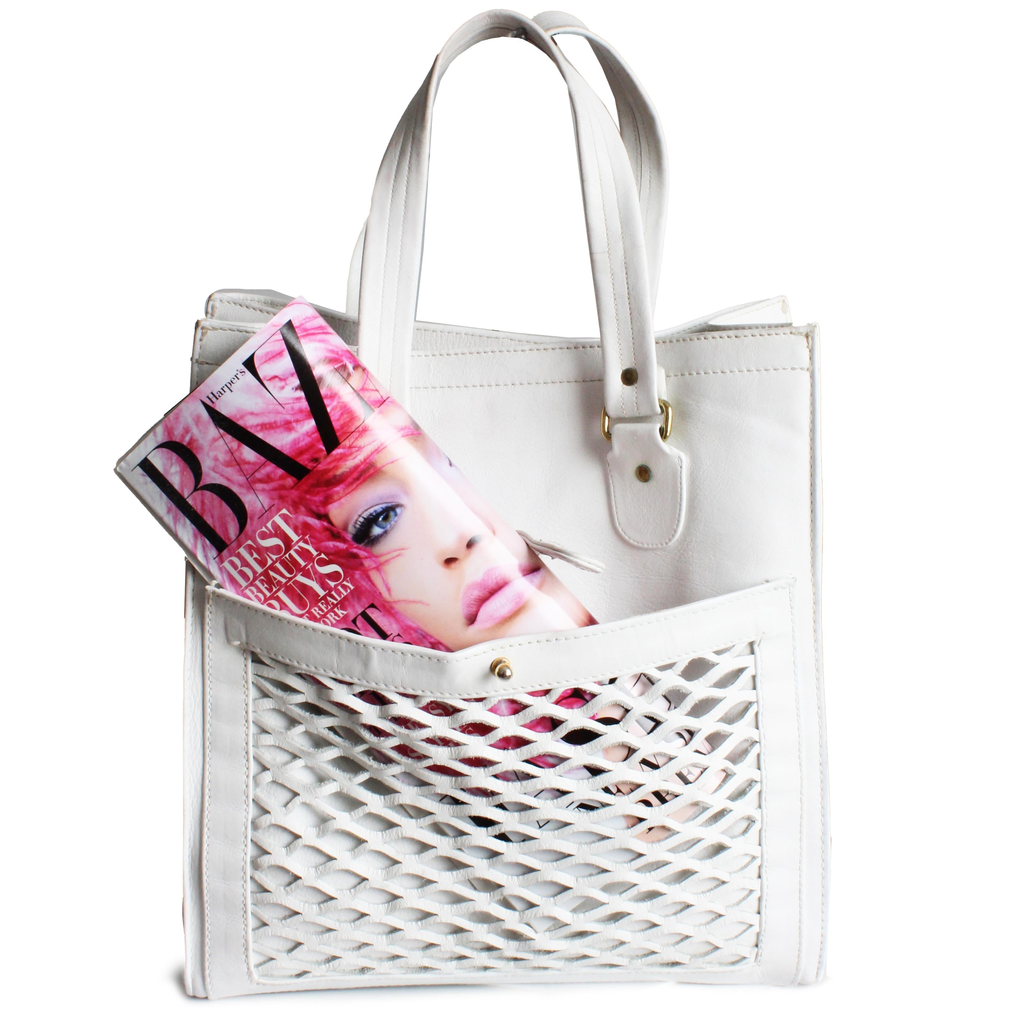 Preowned, vintage, authentic Bonnie Cashin for Meyers large white leather tote bag with basket weave pocket, likely made in the mid 70s following her time at Coach Leatherware. Made from white leather, it features a large basket weave pocket on the