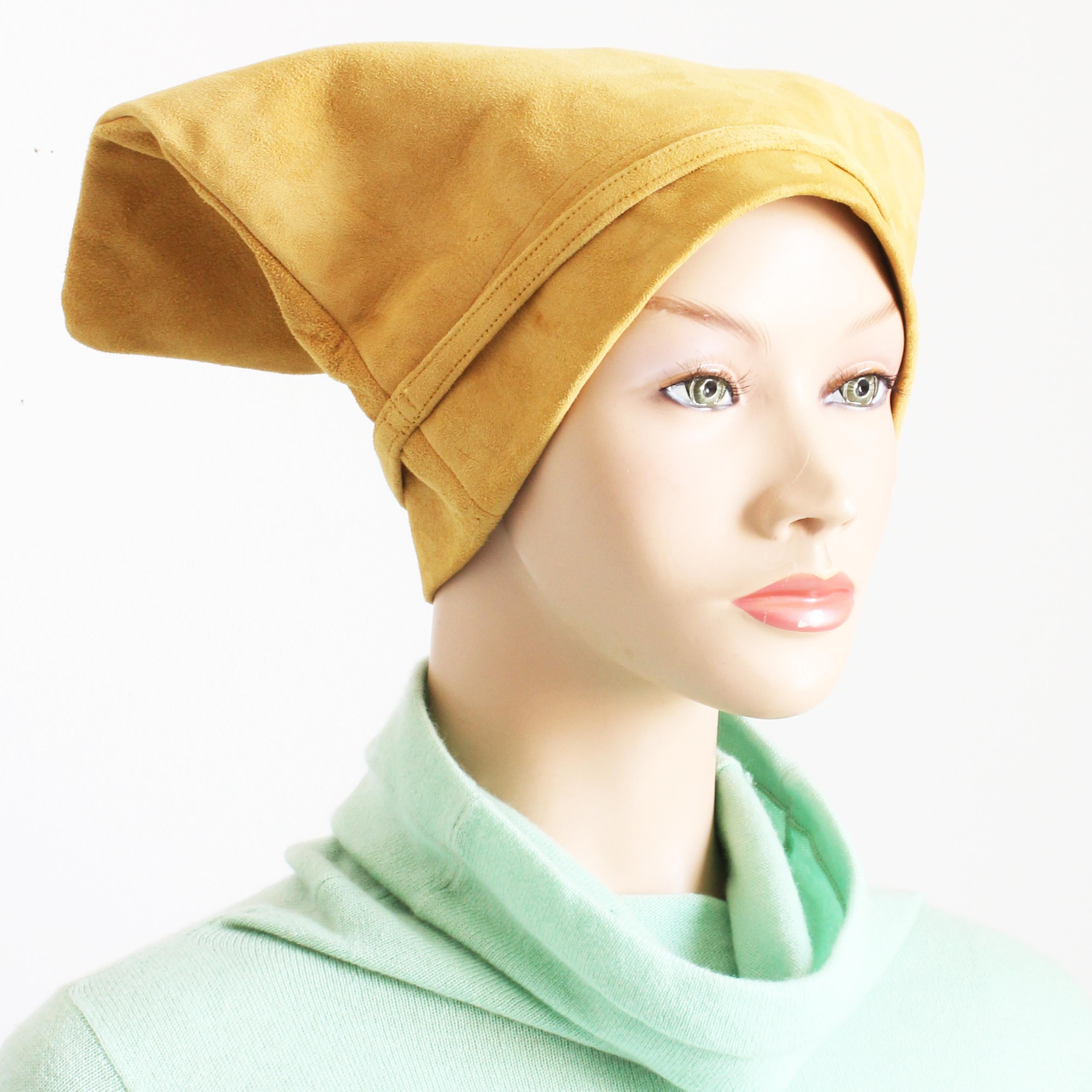 Preowned, vintage 'Bag hat', designed by Bonnie Cashin for Sills, most likely in the 1960s.  Made from supple suede leather in a rich butter-creme tan shade, it has skinny cinch straps at the sides and is lined in soft leather.

Bonnie Cashin's work