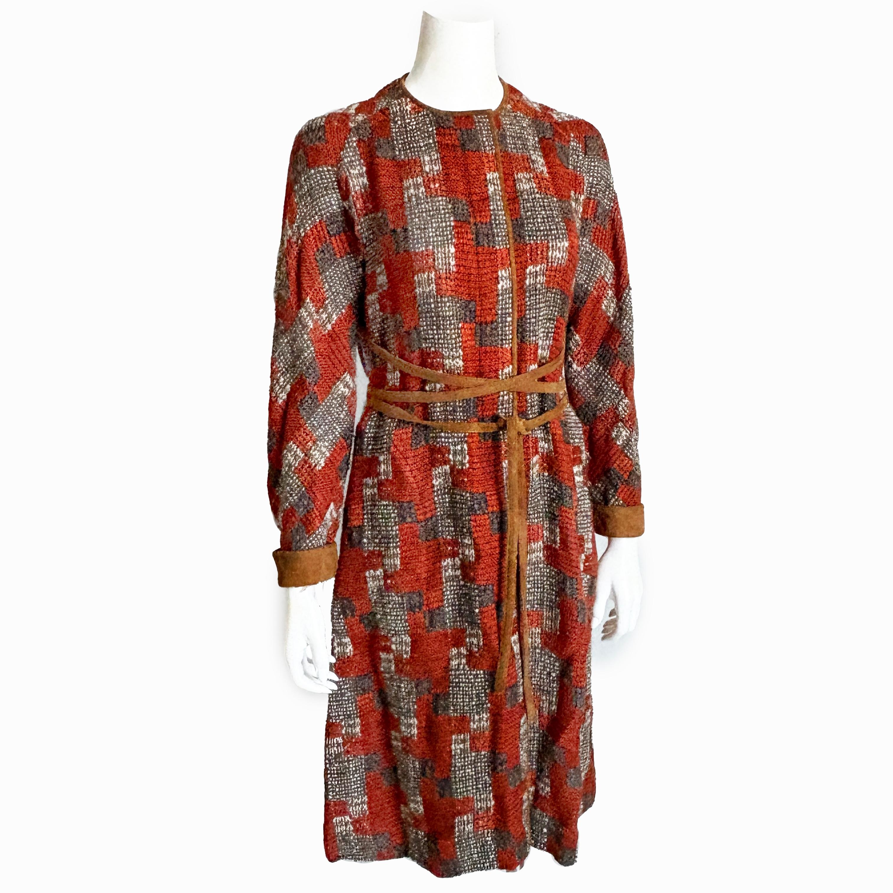 Incredibly rare vintage Bonnie Cashin for Sills coat, likely made in the late 60s.  Made from a geometric woolen tweed in shades of rust, charcoal, cream and tan, it's trimmed in tan suede around the neck, down the placket and at the sleeve cuffs. 