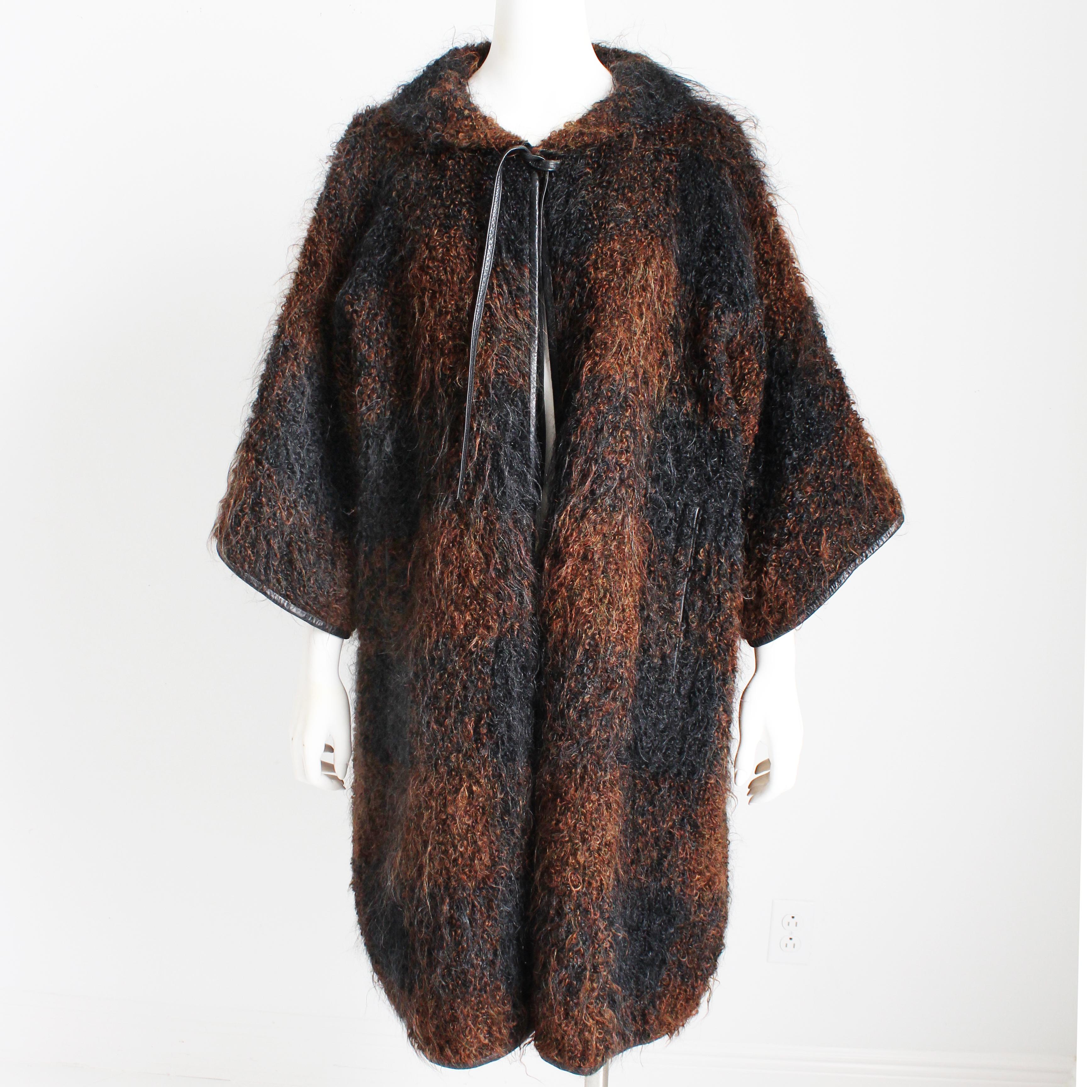 This fabulous woolly mohair coat was designed by Bonnie Cashin during her time at Sills circa 1957. 

This same style NOH coat is part of the collection at the FIDM Museum collection (do a web search of Bonnie Cashin mohair NOH coat FIDM and you'll