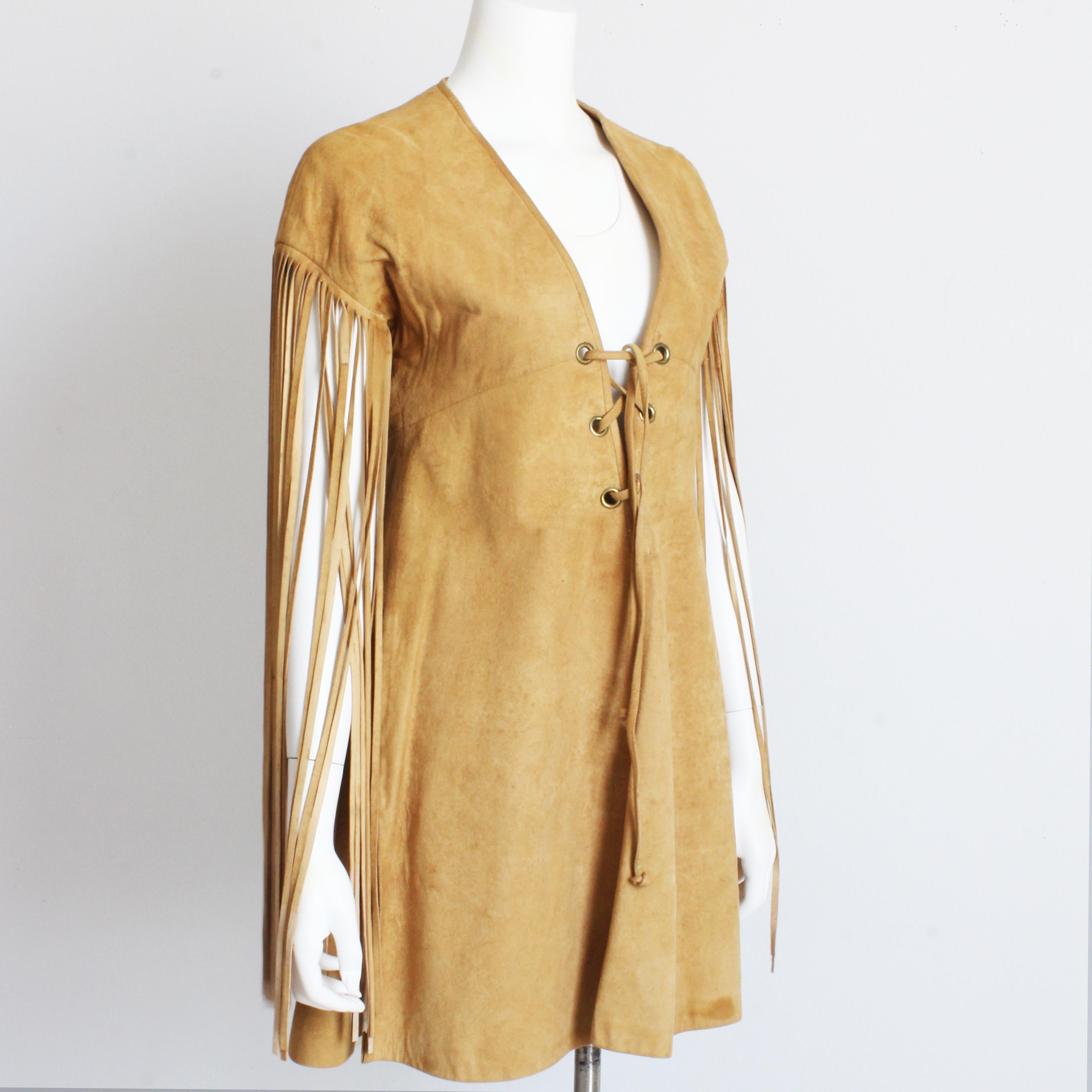 Fabulous Bonnie Cashin for Sills chamois leather tunic dress with fringe, likely made in the early 60s.  A similar design can be seen in Bonnie Cashin's fashion sketch called 