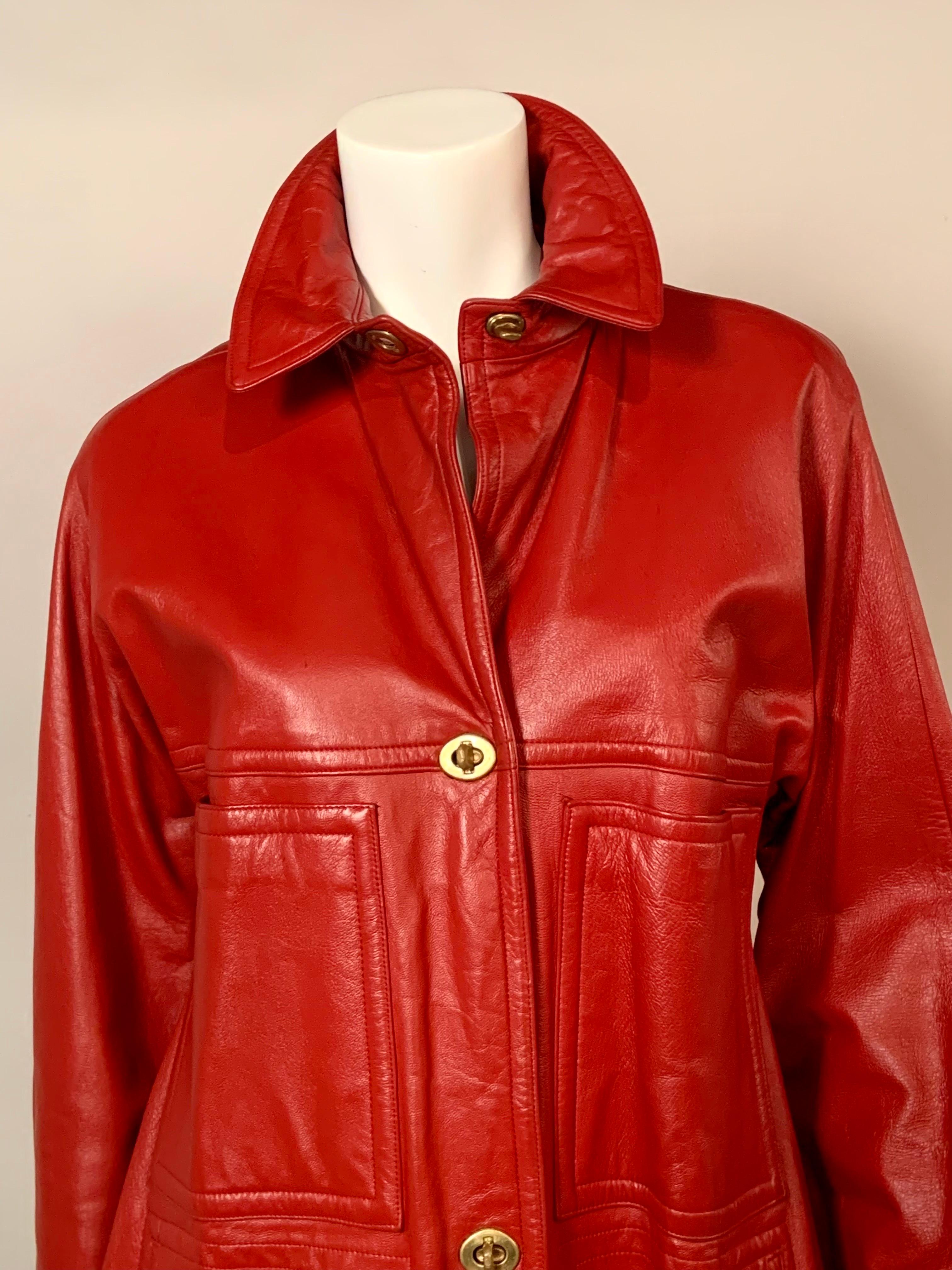 This cheerful bright red leather coat was designed by Bonnie Cashin for Sills in the 1960's.  It has four large pockets and her signature brass toggle closures. It is fully lined in red silk crepe and it is in excellent condition.  There is no size