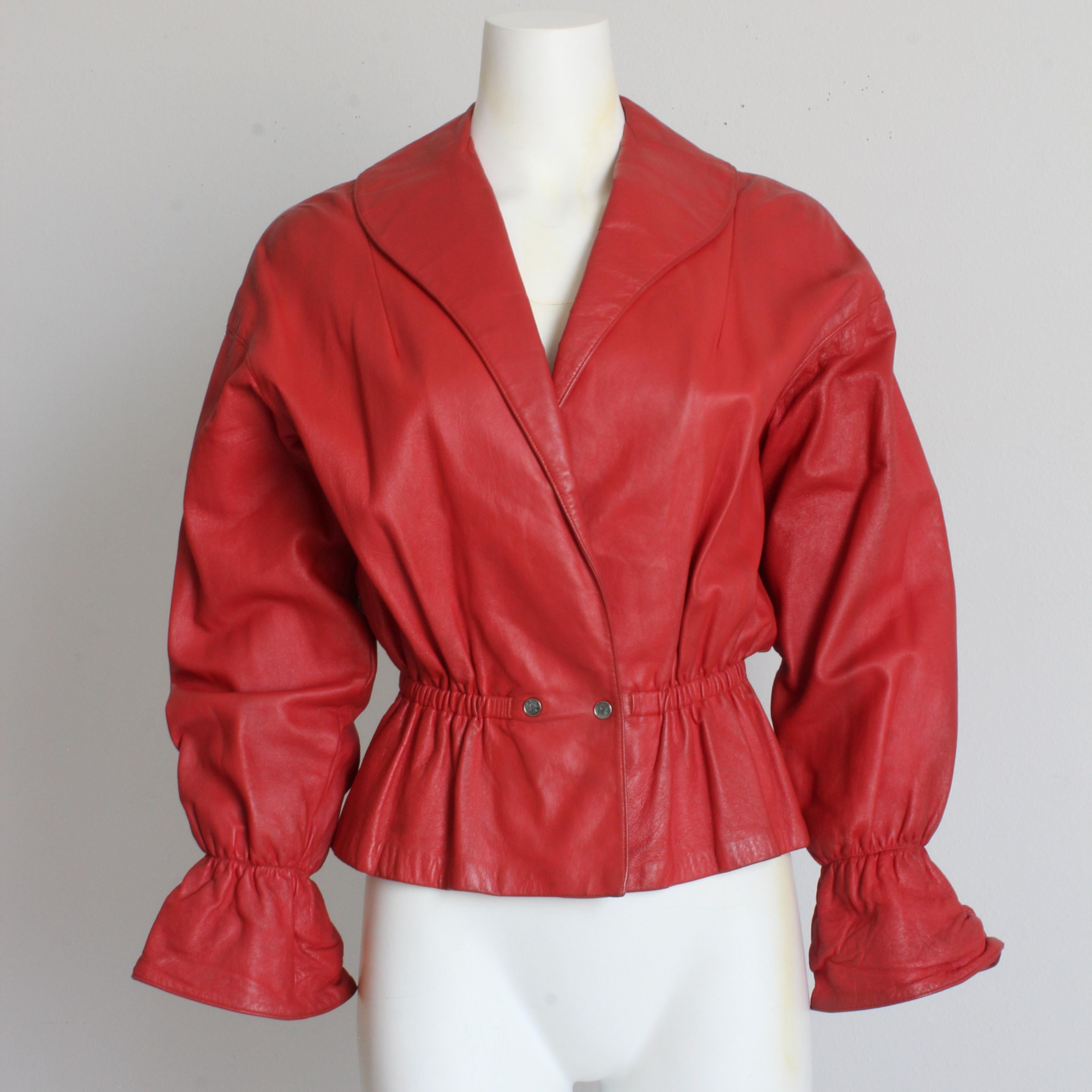 Authentic, preowned, vintage Bonnie Cashin for Sills red leather jacket, circa the early 60s. 

An incredibly rare style from the mother of modern American sportswear!  Made from red leather, it features Dolman sleeves, a shawl collar, elasticized