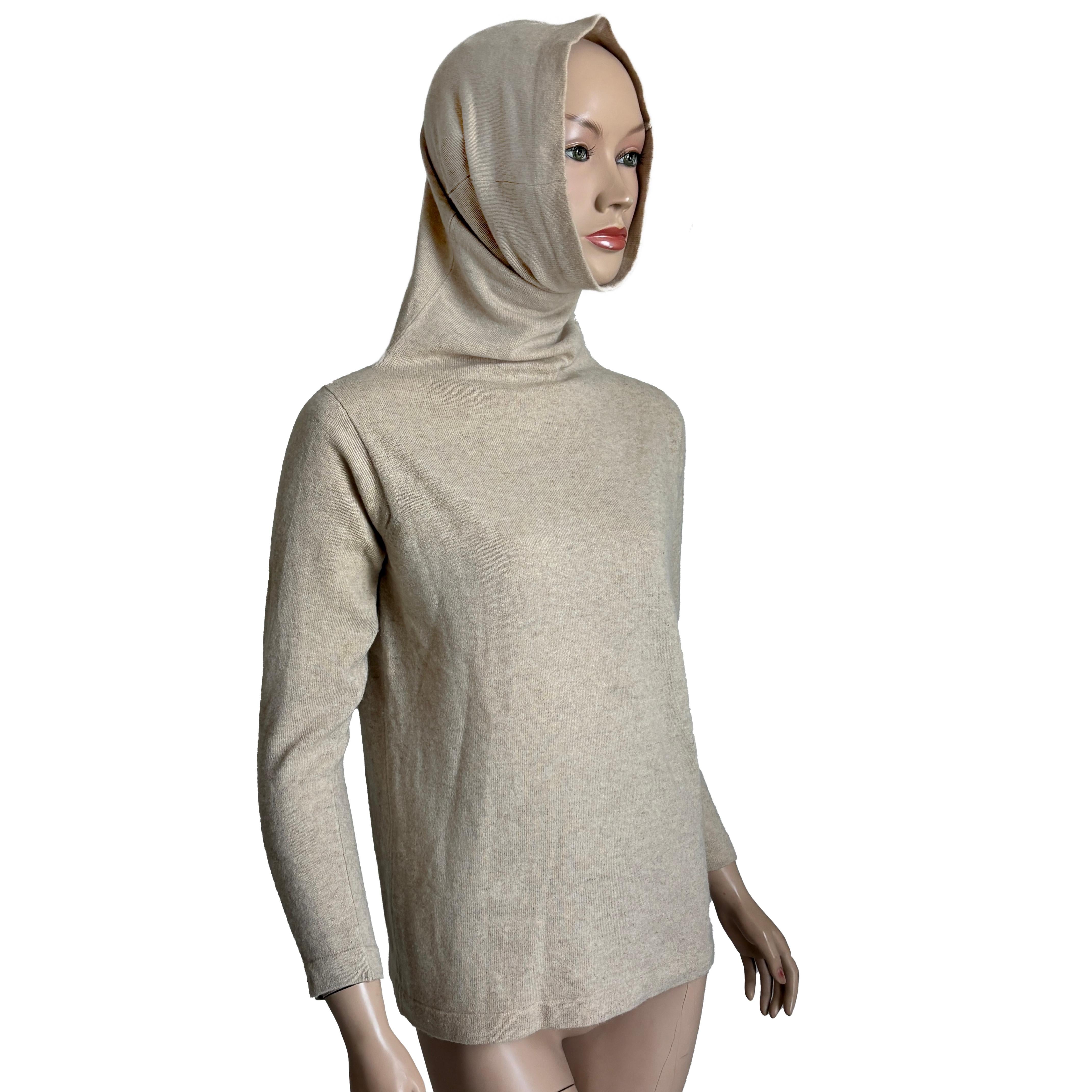 A rare and iconic piece from the mother of modern American sportswear, this vintage Bonnie Cashin funnel neck sweater was originally retailed at Lord & Taylor in the 1970s. True to Cashin’s forward-thinking design philosophy, it combines function