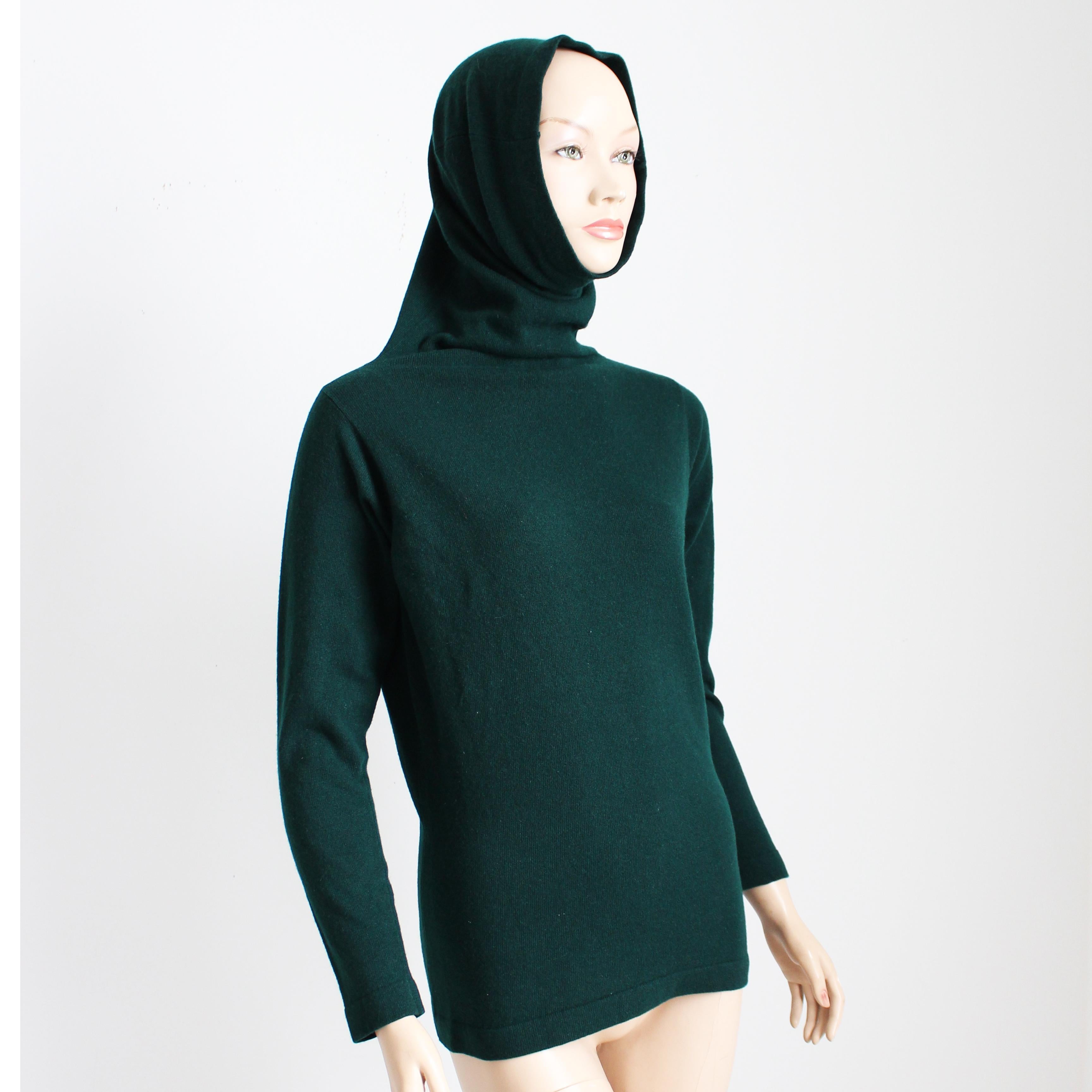 This fabulous sweater was designed by Bonnie Cashin for Saks Fifth Avenue, most likely in the 70s.  Made from a rich forest green cashmere knit, it features Bonnie's wonderful funnel neck, which can be worn on the neck or pulled up over the head for