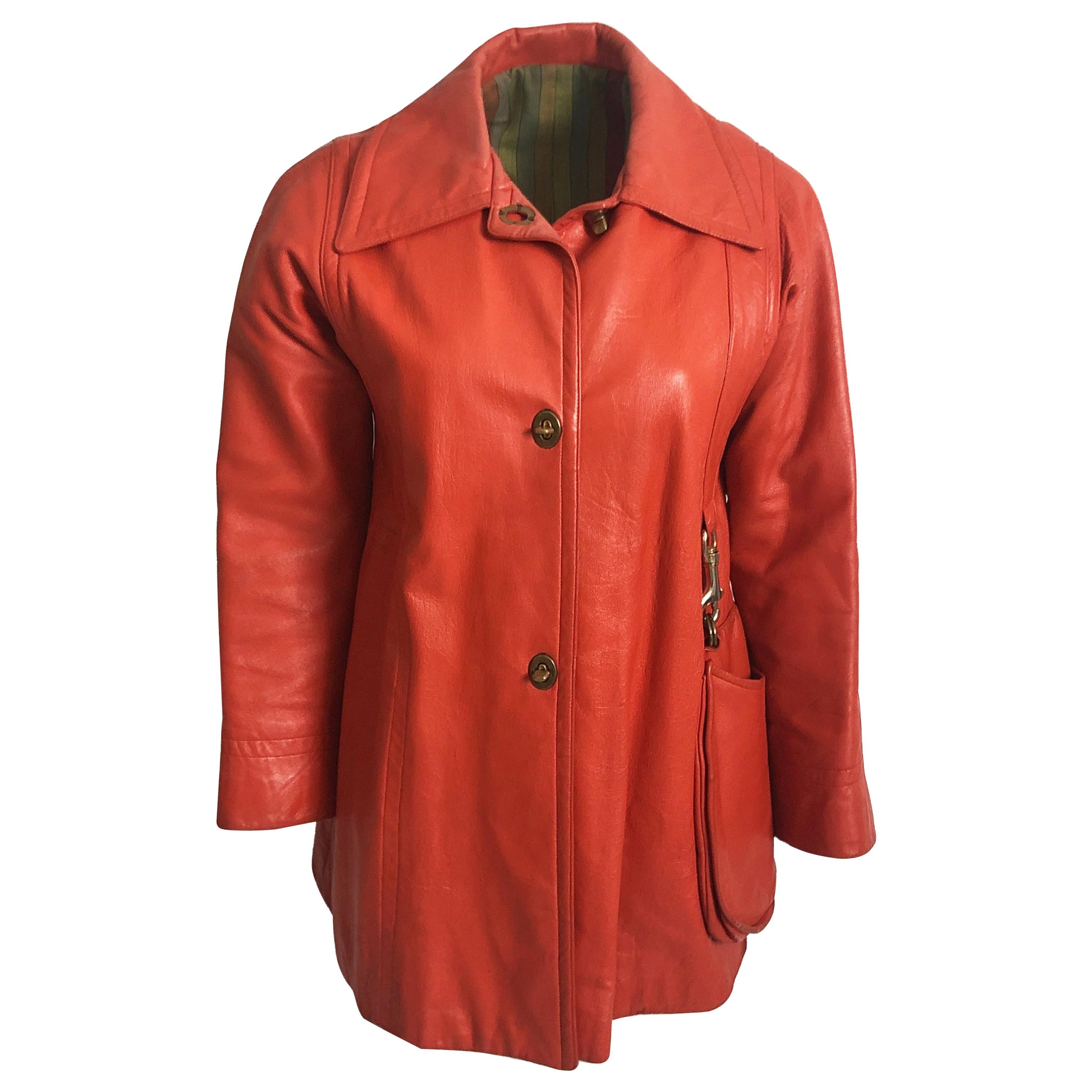Vintage 60s Bonnie Cashin for Sills tomato red (orange hued tone) leather jacket with attached hobo bag, likely made in the 1960s.  

A super rare piece from the mother of American sportswear, Bonnie Cashin.  Known for her practical, yet stylish
