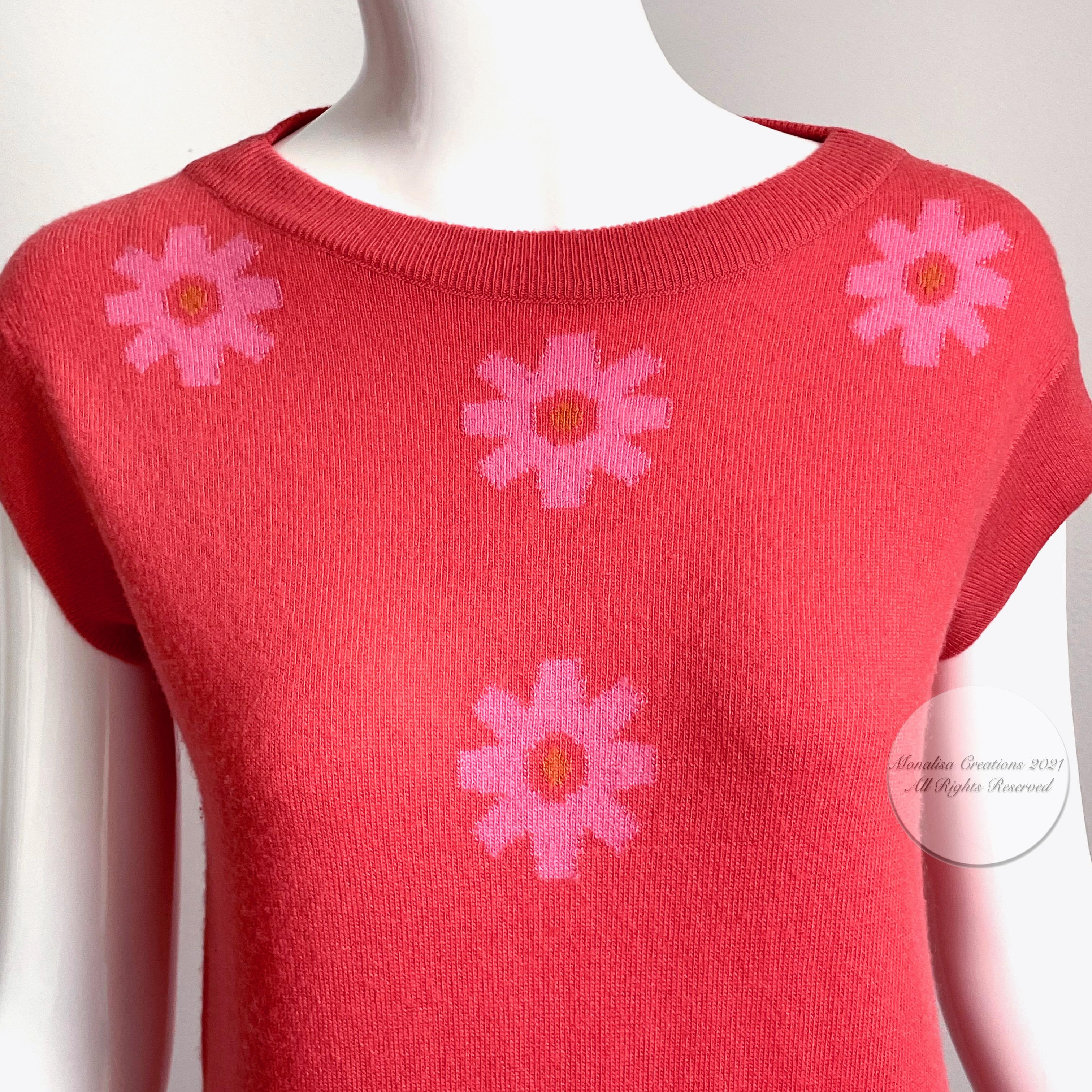 Fabulous vintage 60s Bonnie Cashin pink cashmere dress, made in Scotland for Saks Fifth Avenue by Caerlee.  Made from an incredibly supple carnation pink knit, it features gorgeous Intarsia floral detailing at chest.  

Bonnie Cashin's designs exude