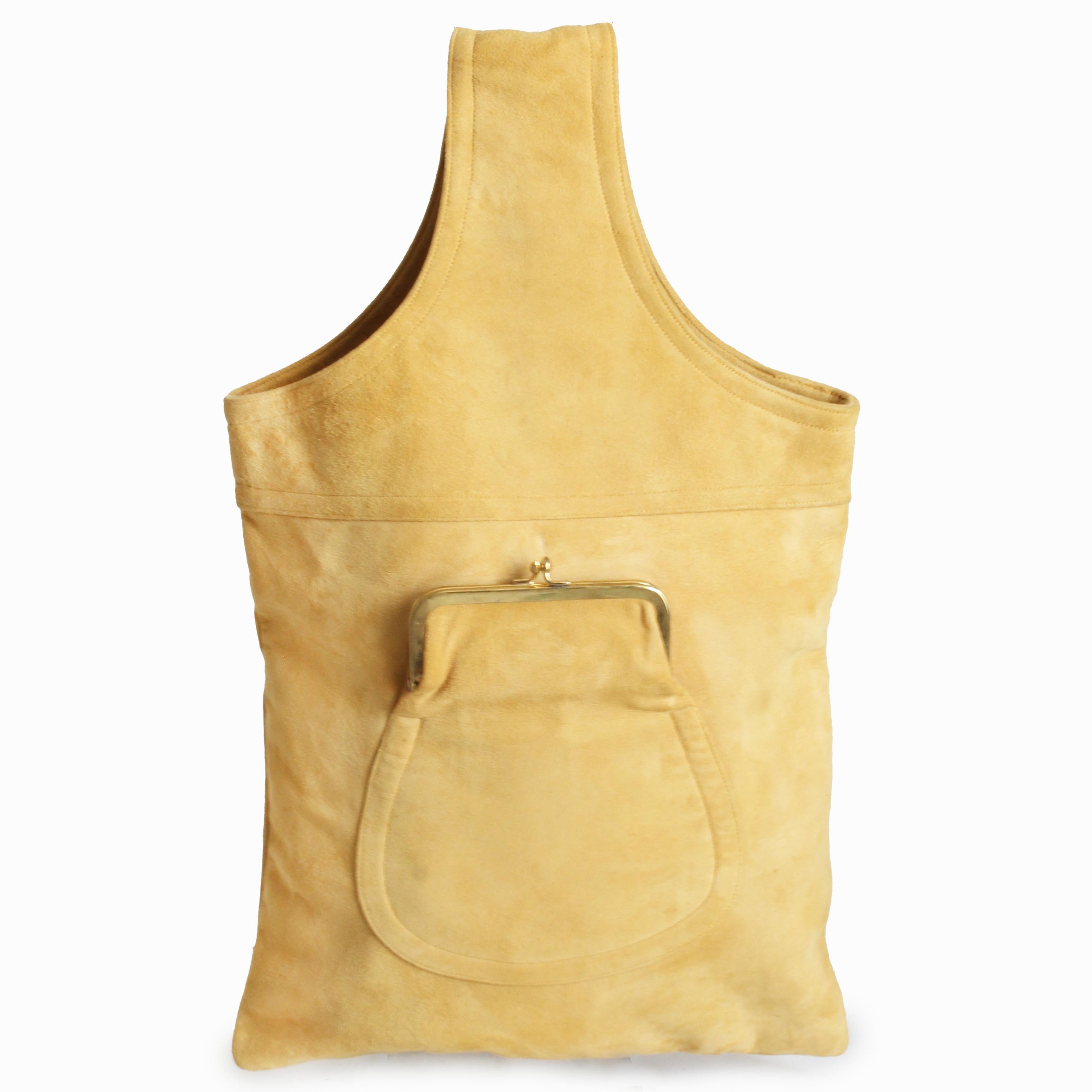 Preowned, vintage Bonnie Cashin sling bag, from her 'Cashin Carry' collection of handbags and accessories, likely made in the 1960s.  Made from a supple butter creme hued suede, this fabulous tote bag features a kiss lock coin pocket in front that's