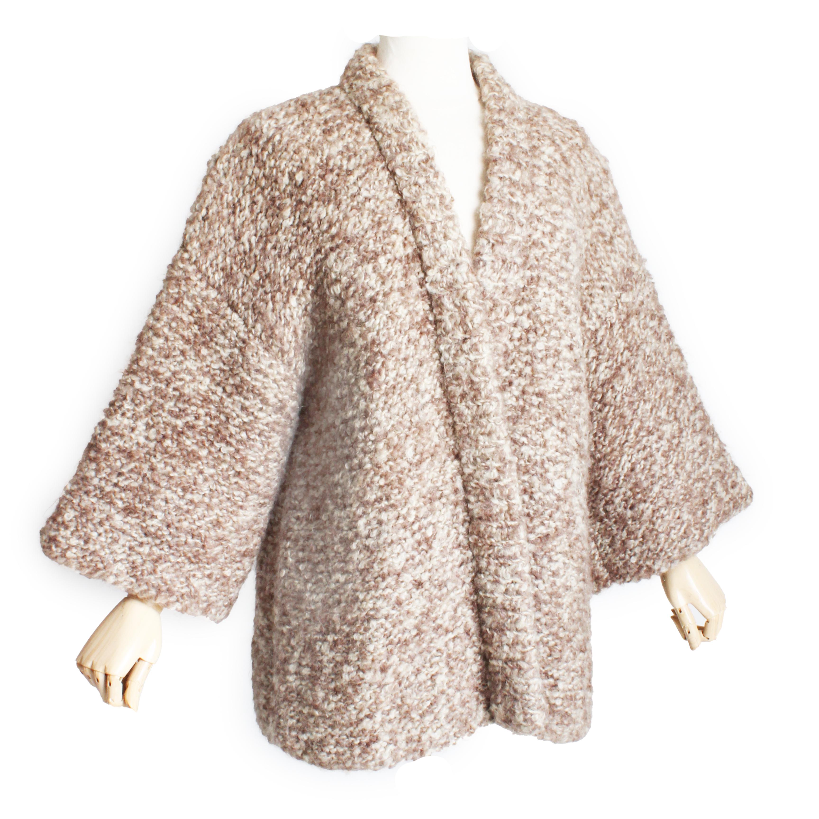Preowned, vintage Bonnie Cashin 'The Knittery' Noh cardigan jacket, made in 1972.  Crafted from a substantial chunky knit in shades of oatmeal, cream and brown, it features Kimono-style sleeves and open construction, making it perfect for layering