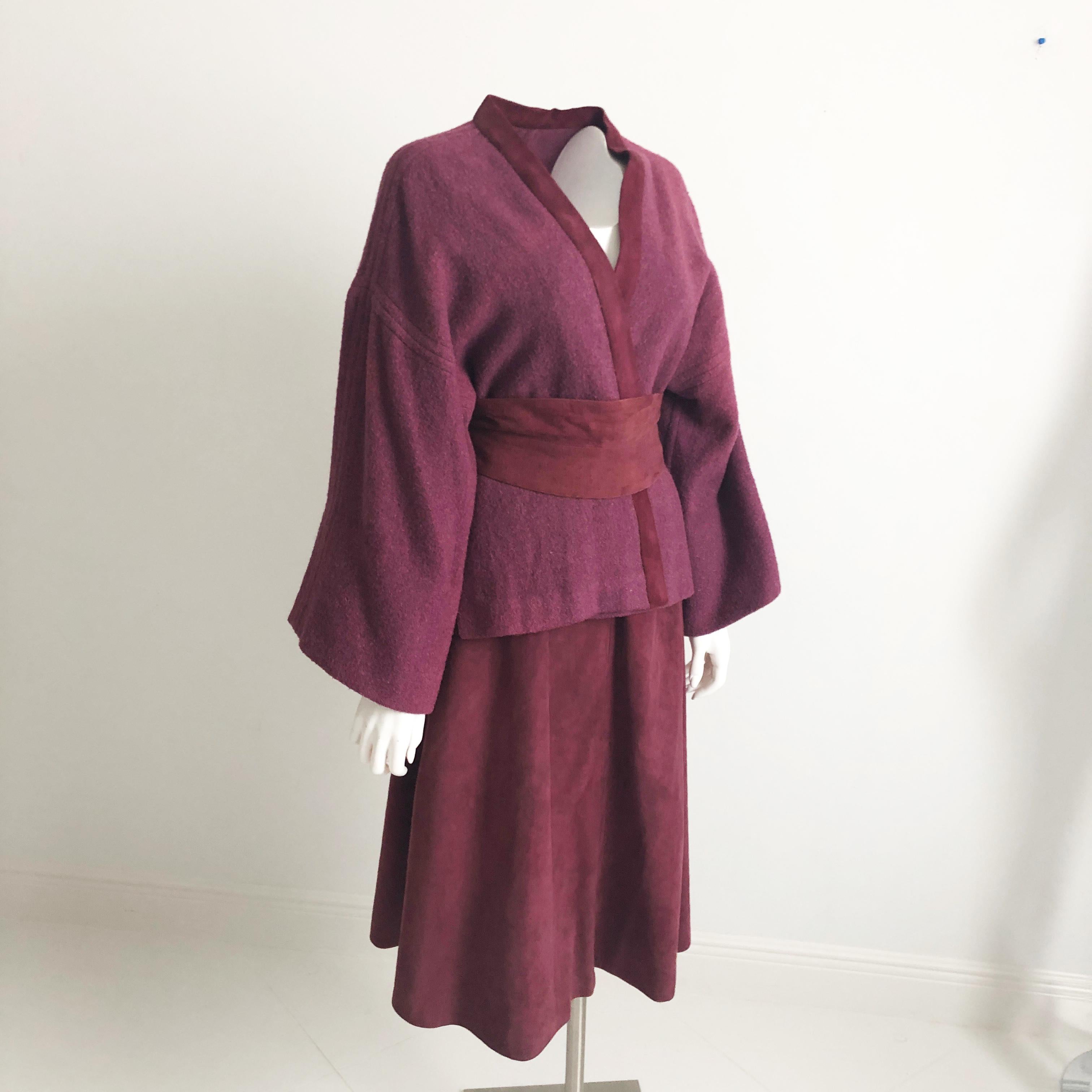 Bonnie Cashin was inspired by her travels and created pieces that were both stylish and practical.  This rare ensemble is wonderful example of her creative genius and features a wine-colored wool Kimono jacket trimmed in suede, a silk-lined suede