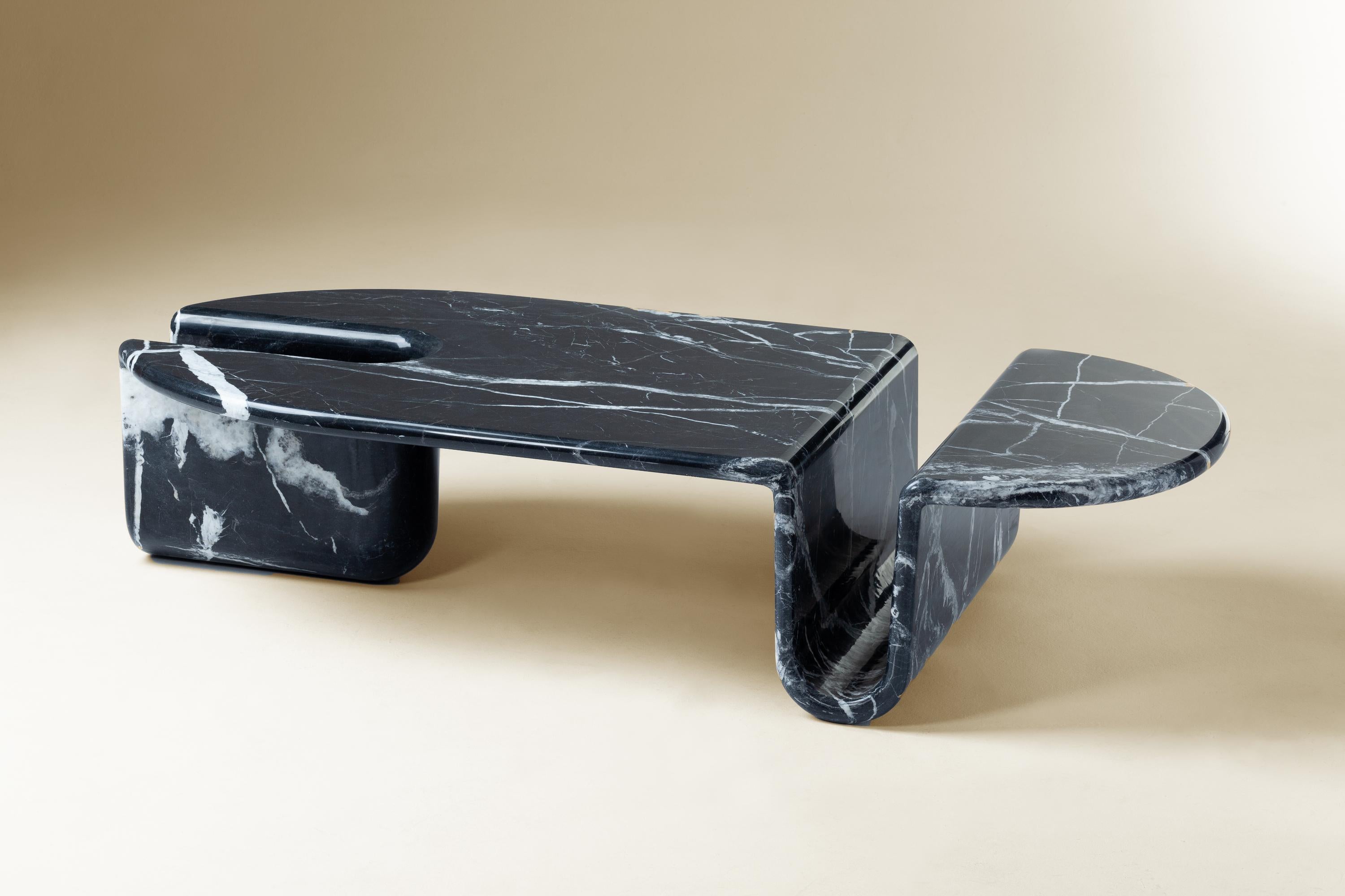 Bonnie & Clyde Nero Marquina marble center table by Dooq
Measures: W 160 cm 63”
D 70 cm 28”
H 35 cm 14”

Materials: structure carved from one solid marble piece

Dooq is a design company dedicated to celebrate the luxury of living. Creating