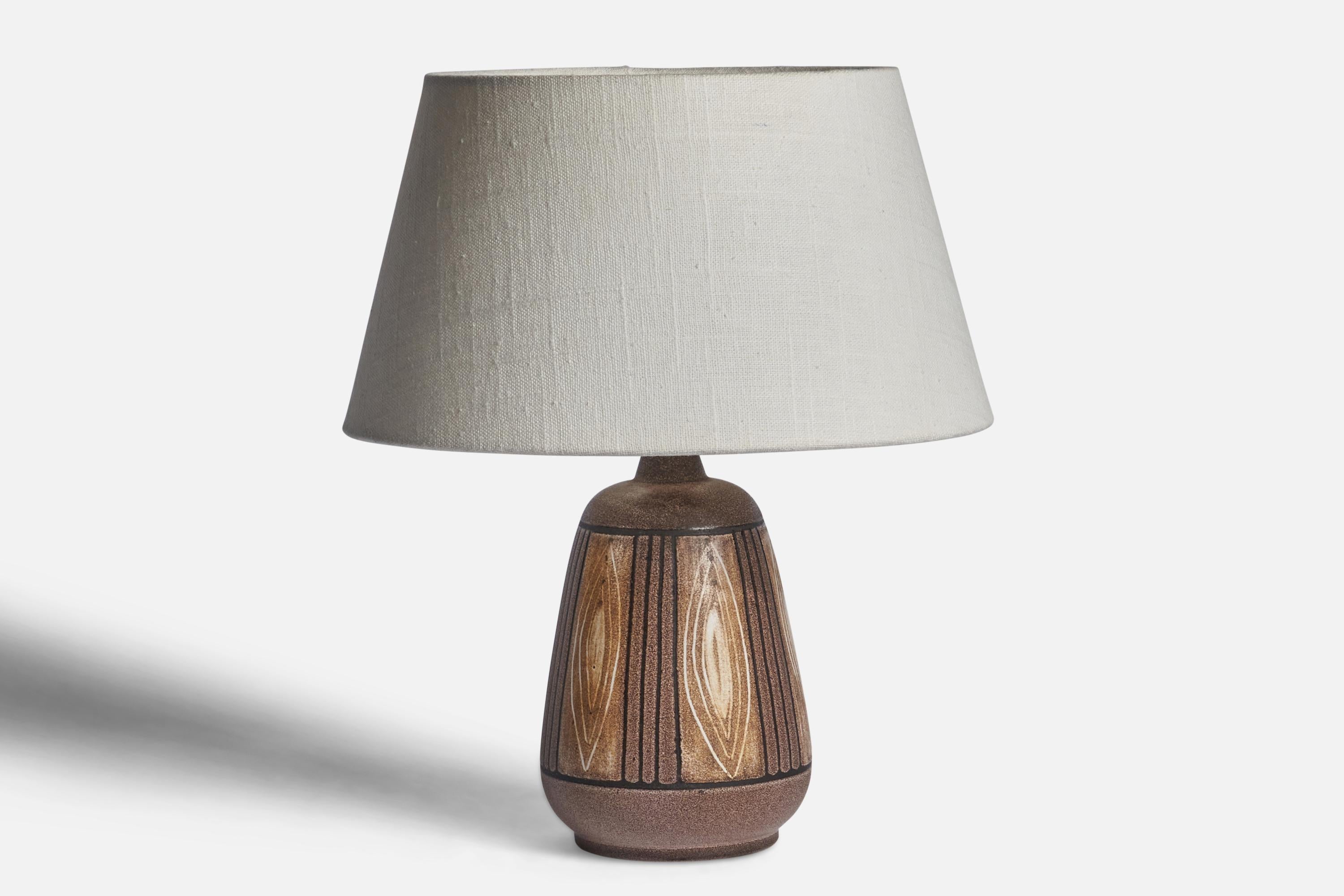 A brown-glazed and hand-painted stoneware table lamp designed by Bonnie Rehnqvist and produced by Törngrens Keramik, Sweden, 1970s.

Dimensions of Lamp (inches): 9” H x 4.5” Diameter
Dimensions of Shade (inches): 7” Top Diameter x 10” Bottom