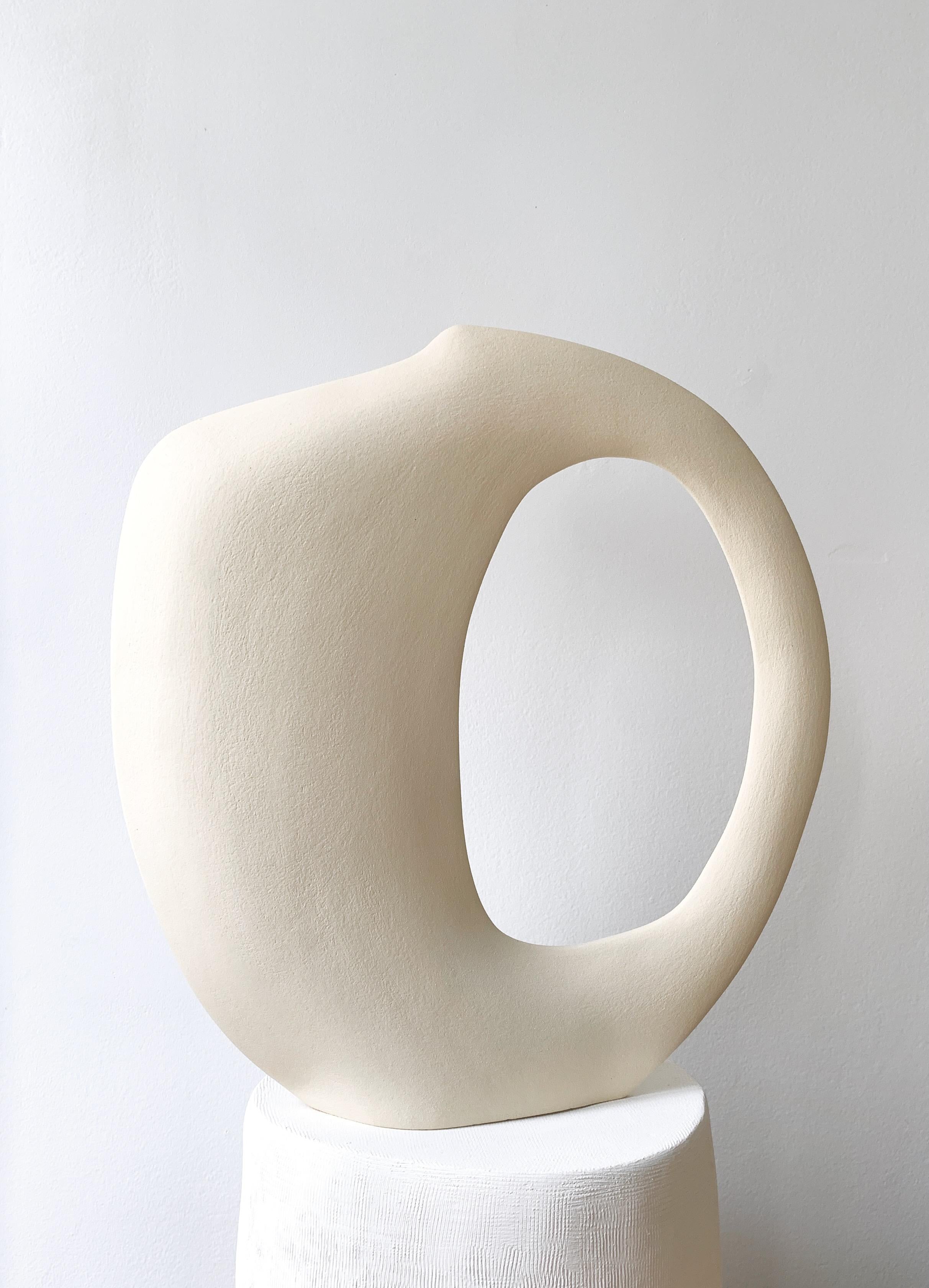 Bonnie Tribu M40.22 Sculpture by Léontine Furcy.
Unique piece.
Materials: Raw white sandstone.
Dimensions: L 38 x H 40.5 cm.

Léontine Furcy, ceramic artist, tells about herself in shapes, textures, curves, asymmetries, purifications. Each of