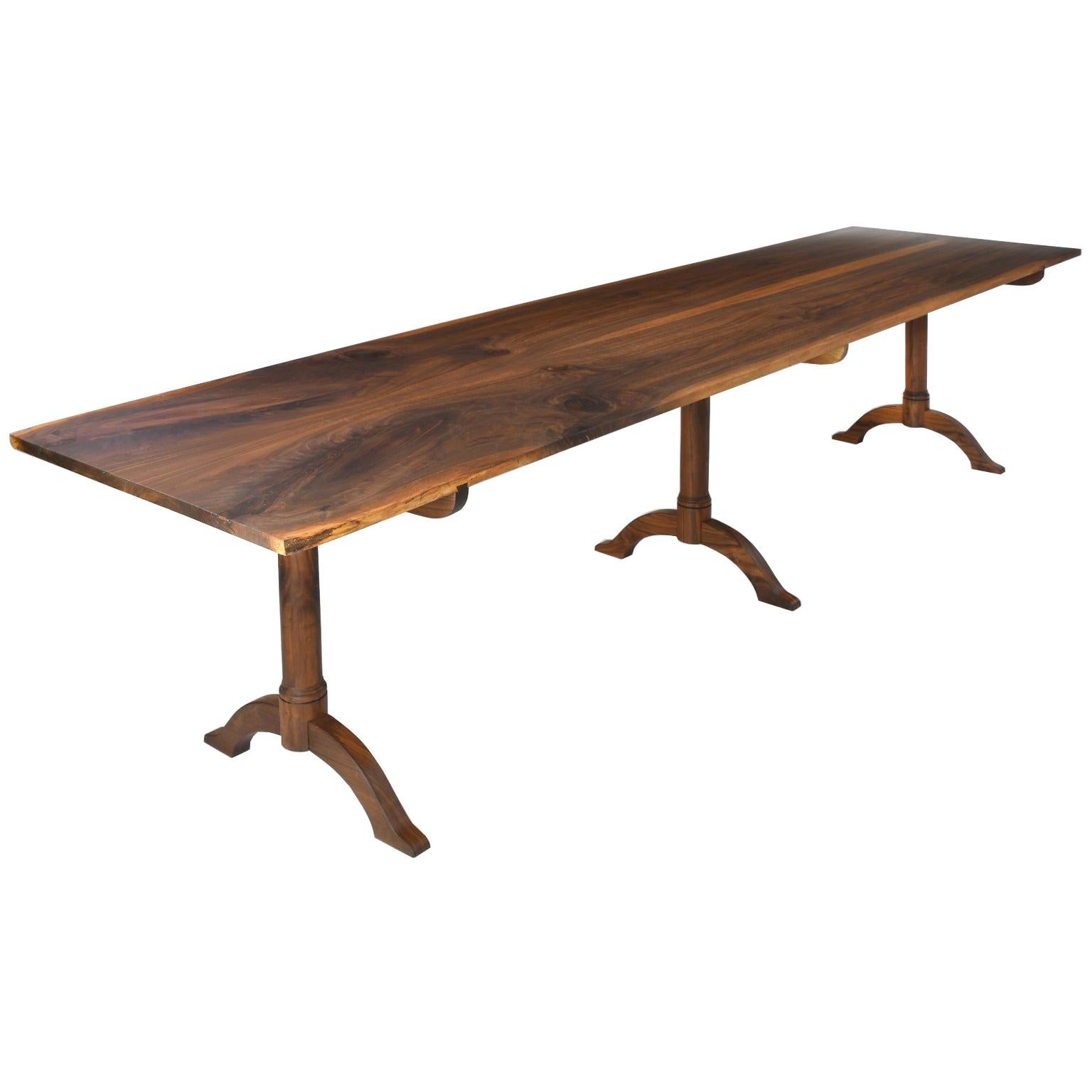 
This table as show is available for immediate delivery
Enjoying a minimalist design, this Bonnin Ashley custom-made dining table evokes the sense of a beautiful slab of wood floating in space being anchored by three legs without an apron or a