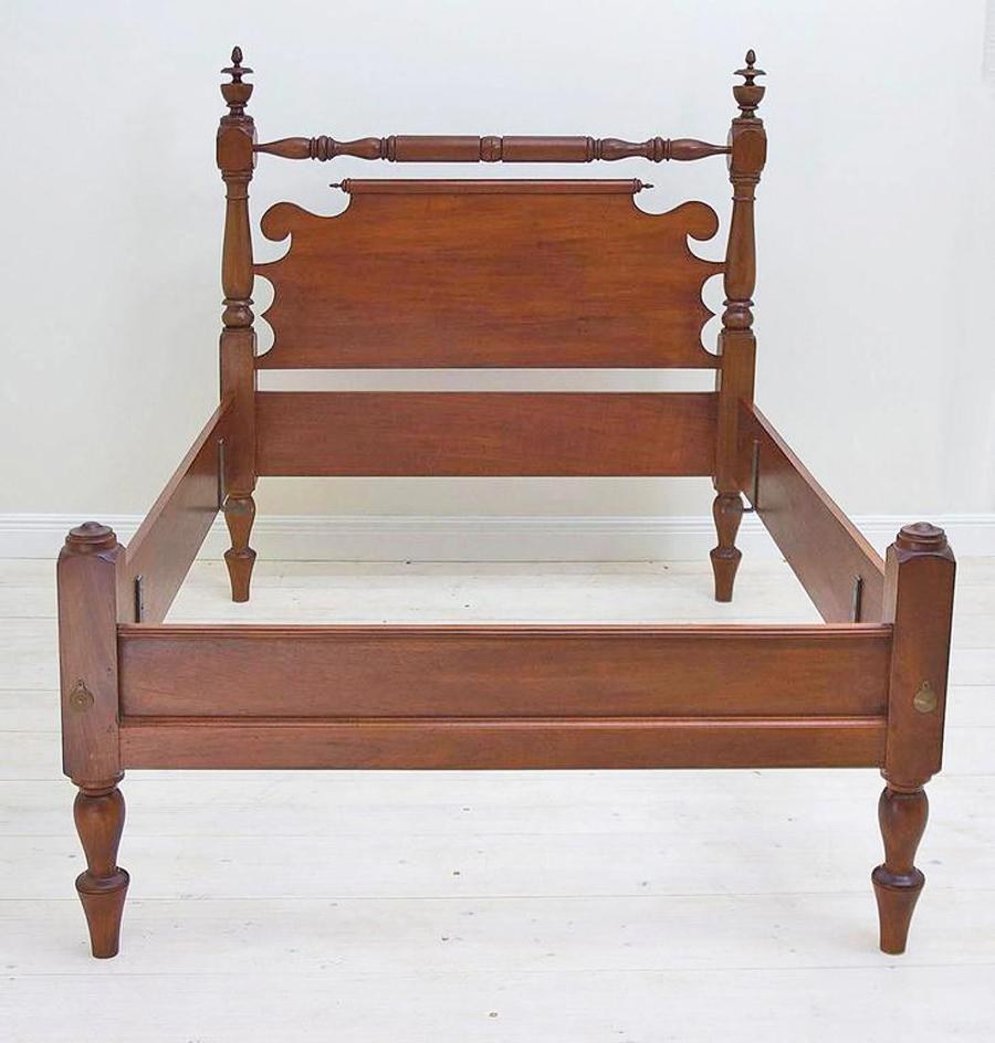 Custom cannonball bed inspired by an early 19th century American bed in our inventory. Fabricated in our workshop out of poplar and expertly stained and finished, this antique style bed offers the comfort of a standard Queen, Full or Twin box and