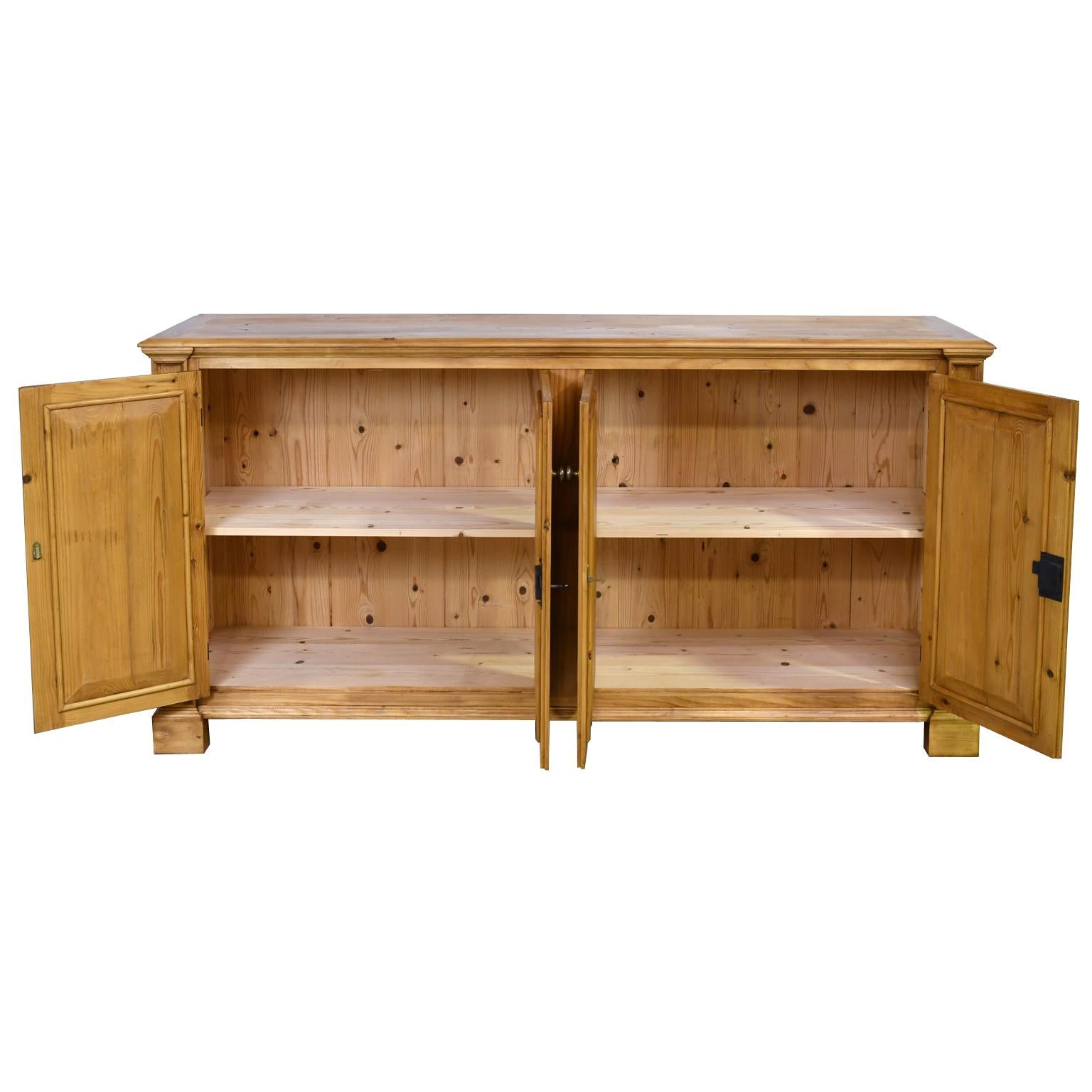 A Bonnin Ashley custom-made sideboard, with four cabinet doors, floating side panels and a sandwich board top. All of the joinery is mortice and Tenon construction and all floating panels are chamfered including the back of the cabinet with tongue