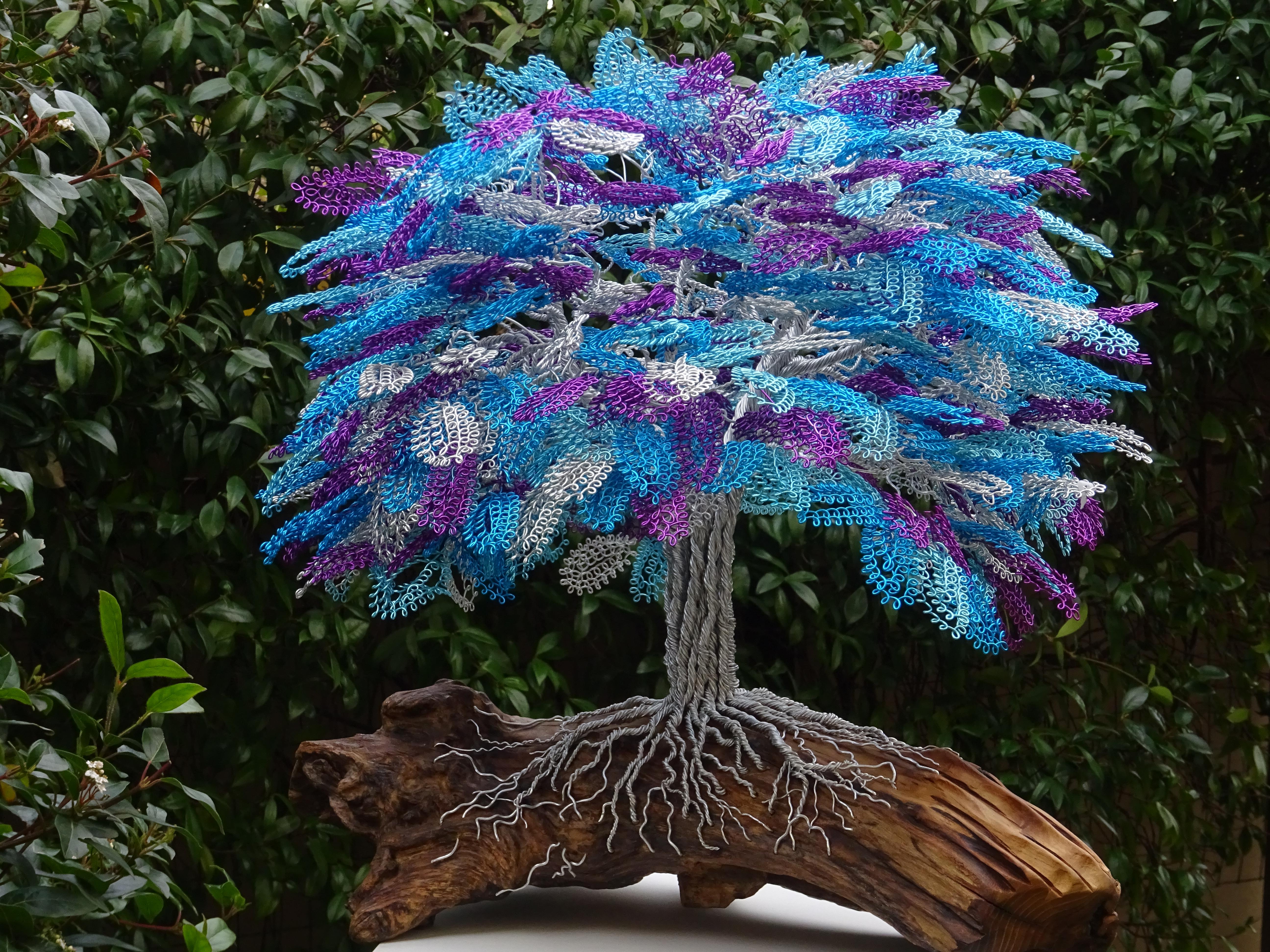 Unique piece sign by the artist.

The sculpture was commissioned for the first time by a customer in Sicily, who had a specific request, namely a tree with purple, turquoise and silver as the dominant colours. From here the choice fell on this